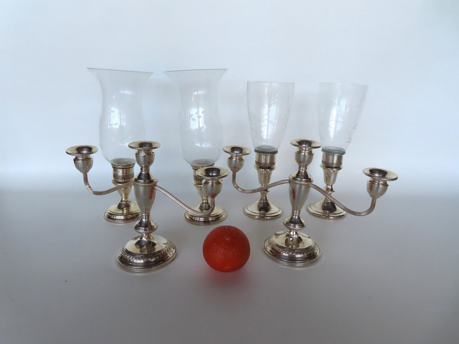 Three pair of weighted sterling silver candlesticks. The first 2 pairs are with etched glass shades (1 of 5)