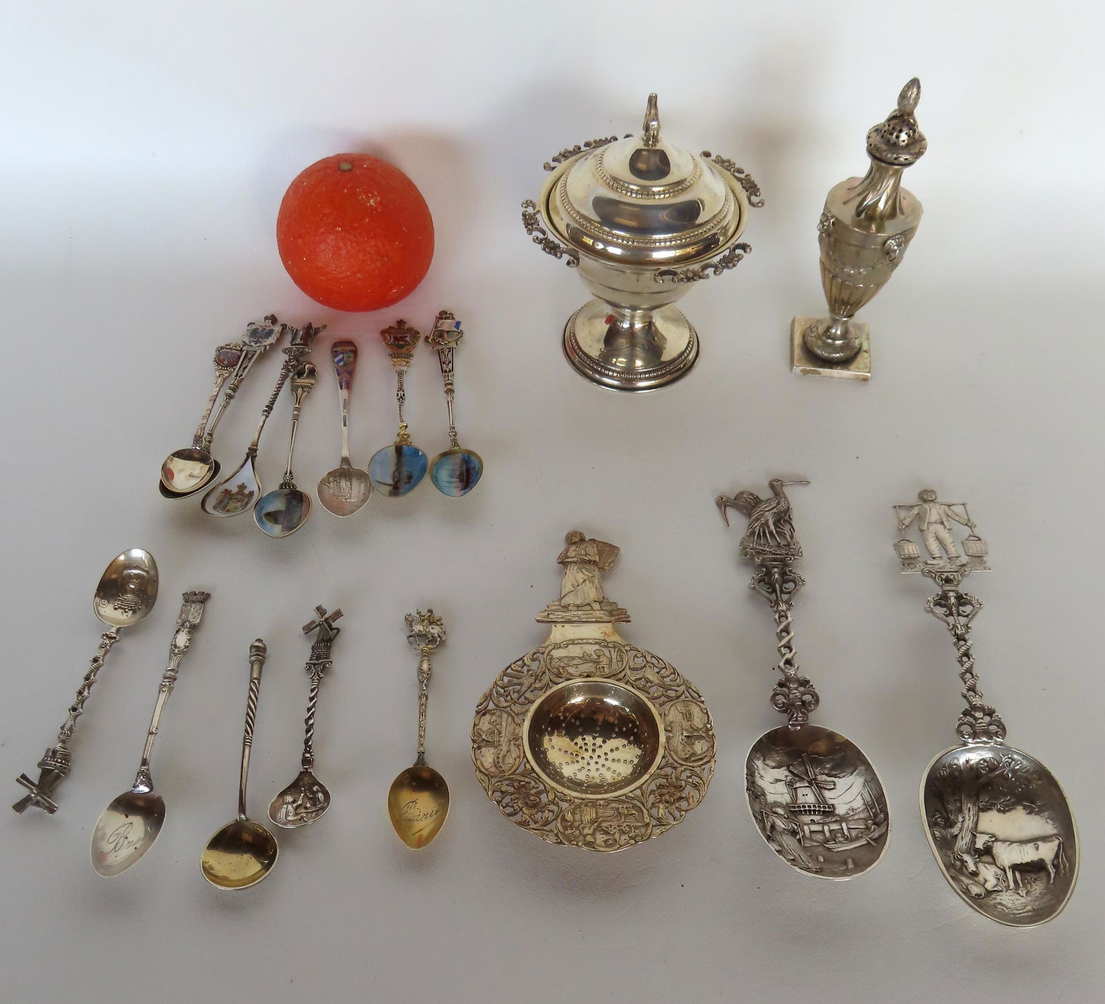 A grouping of European silver including: An early fancy salt shaker marked .800 silver; an .800 (1 of 9)