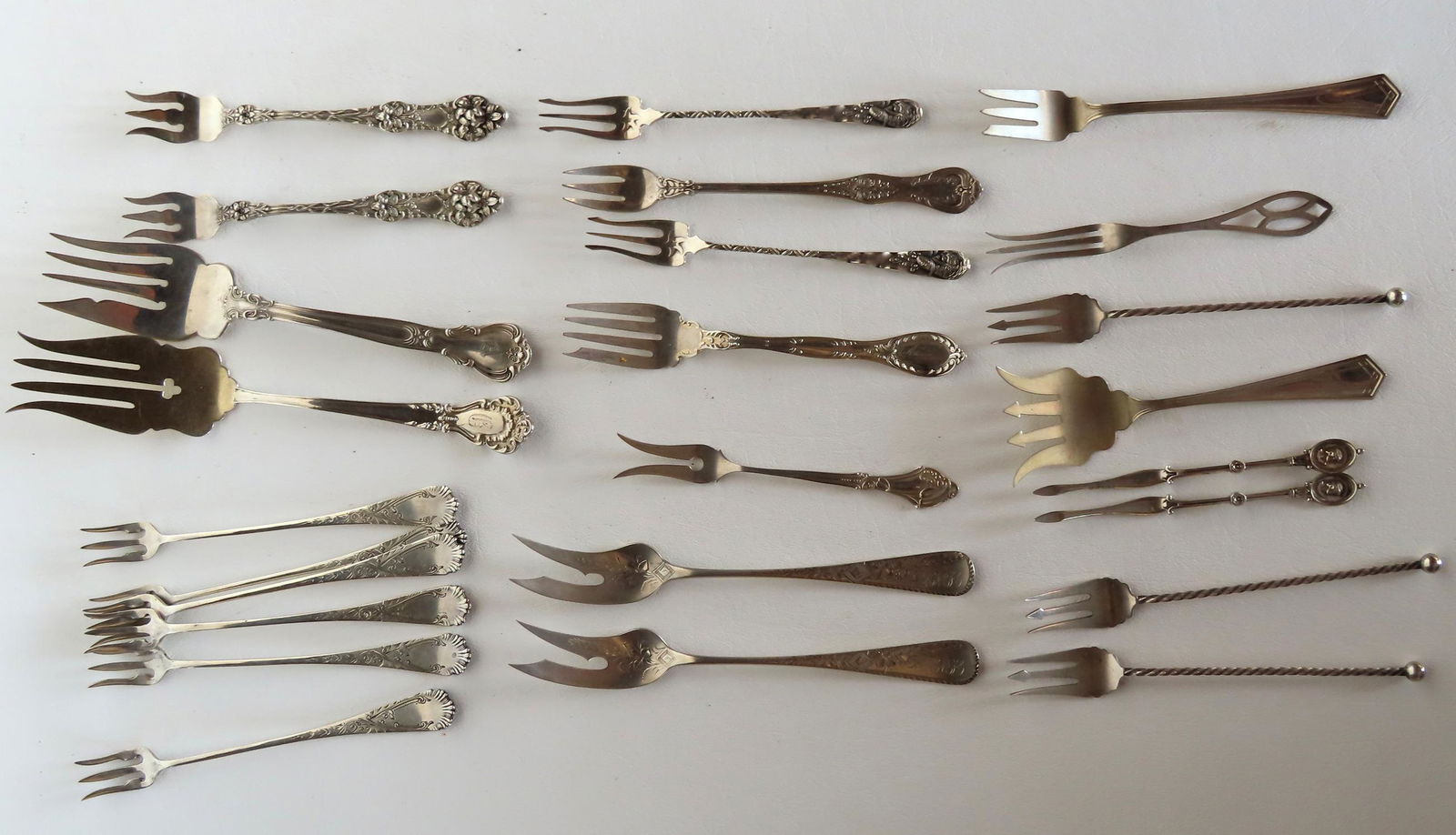 Grouping of 23 sterling silver serving forks including 6 matching pickle forks circa 1870, 2 John (1 of 3)
