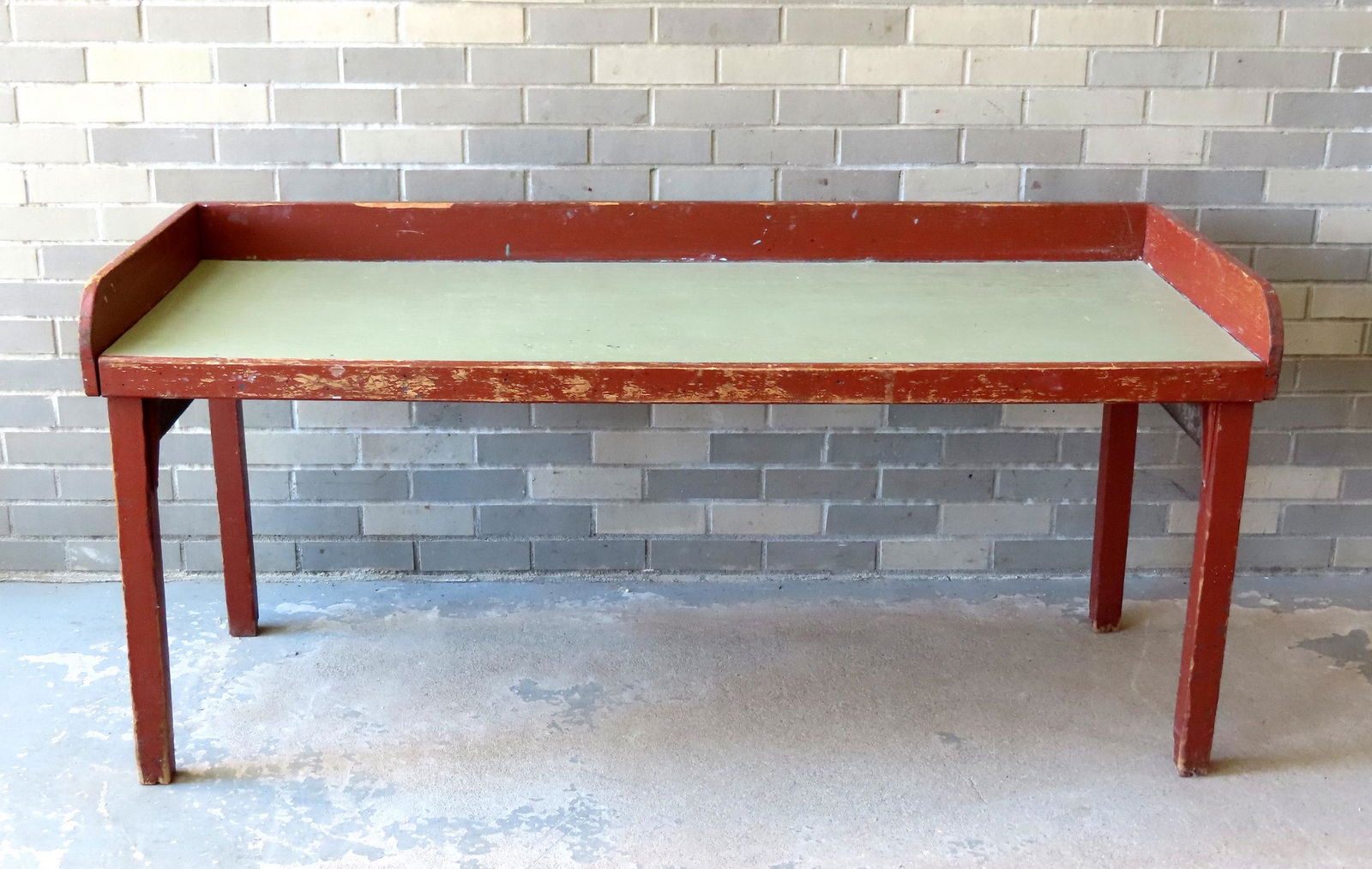 A primitive seed sorting table with square legs supported to frame by iron braces - original red (1 of 5)