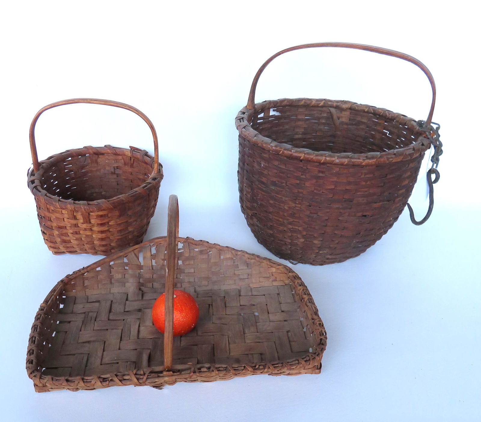 Grouping of 3 splint baskets including: A field basket with looped handle and hand forge iron (1 of 9)