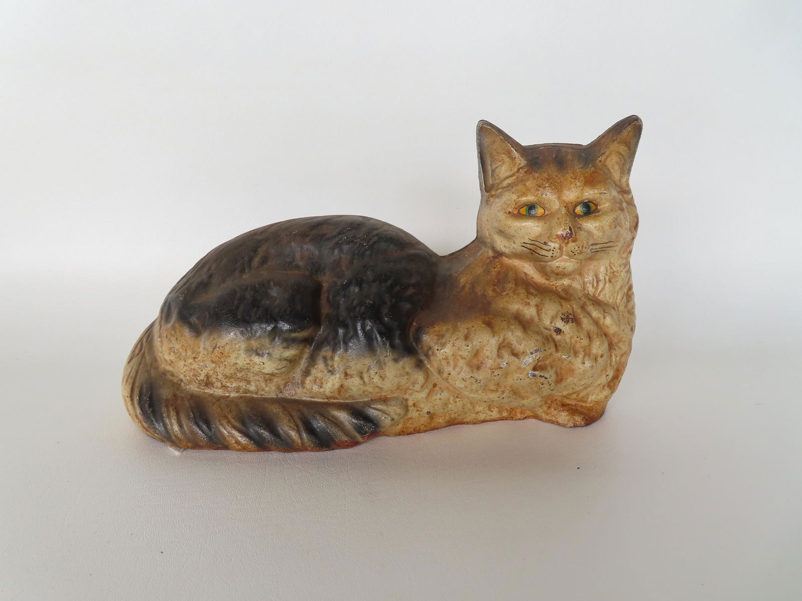 A cast iron resting cat door stop in original paint. Measures 13"W x 7 1/4"H. (1 of 3)