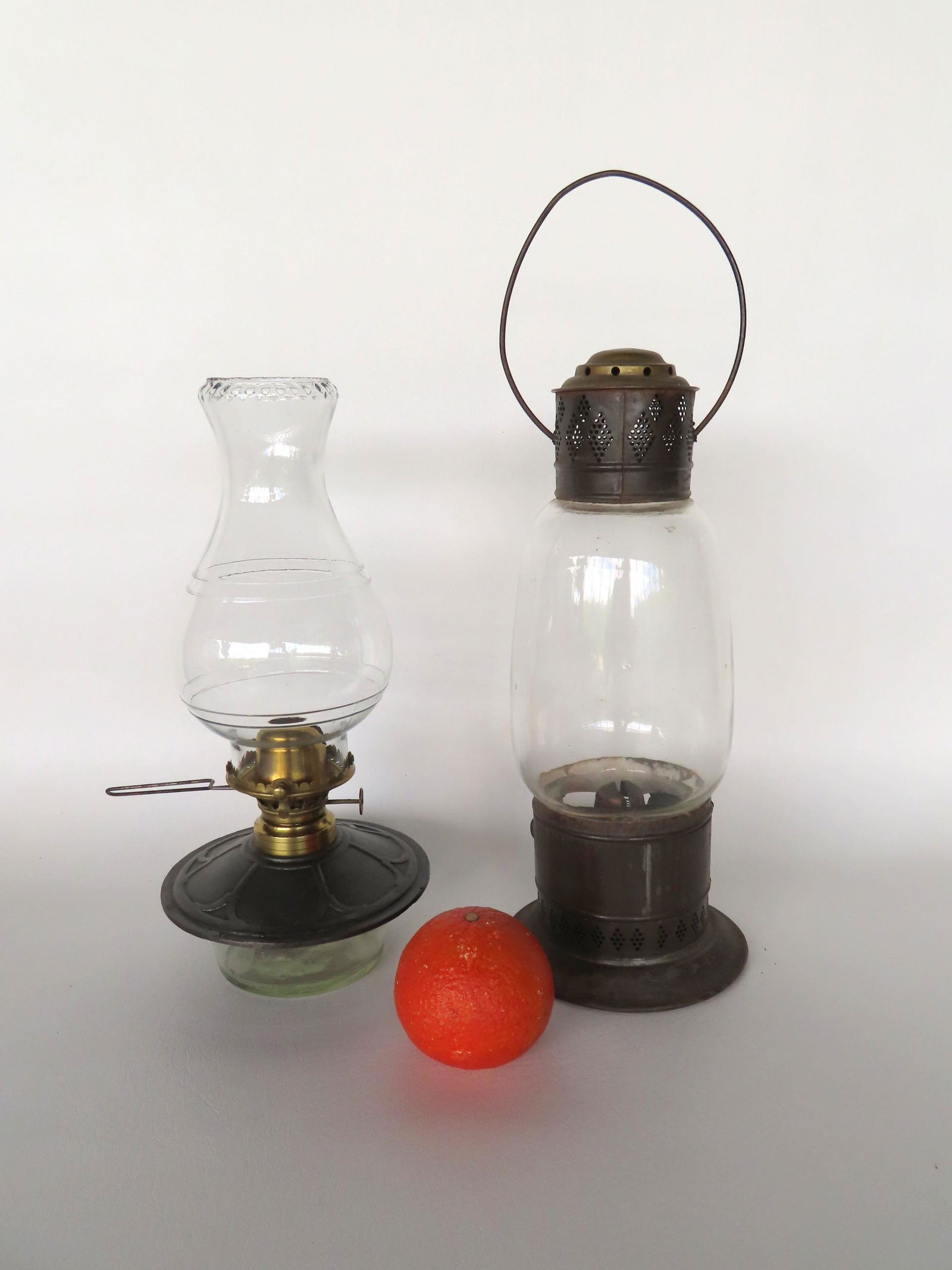 Two 19th century lanterns including: 1) Tin with attached glass 2 mold shade, wire bale handle, and (1 of 8)