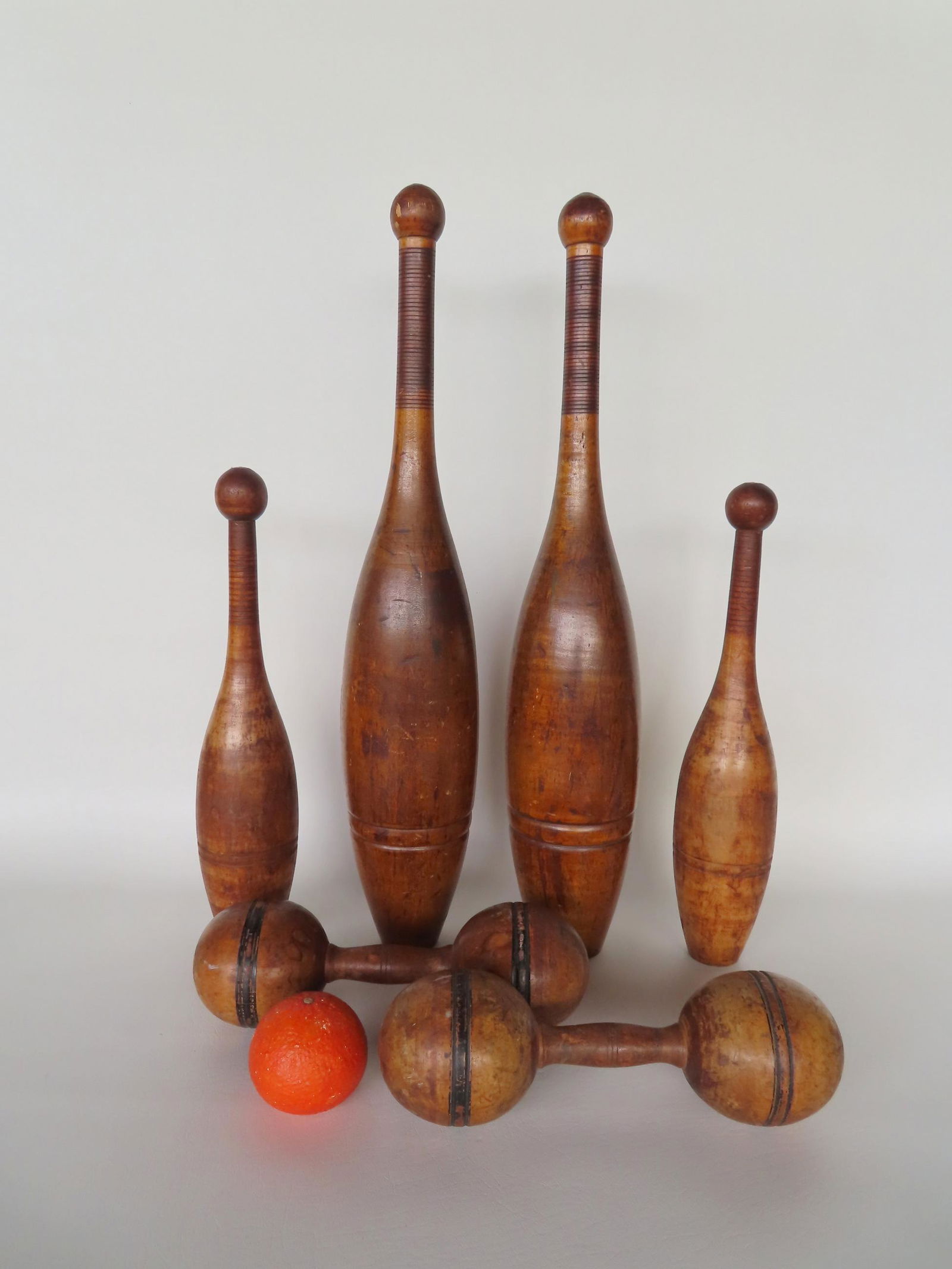 A grouping of 2 pair of large wooden Indian clubs and a pair of wooden dumbbells - 2 lbs. one club (1 of 8)