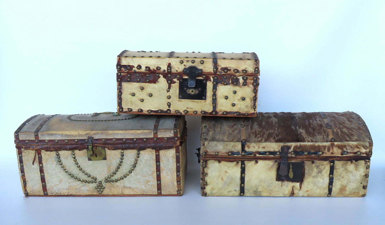 Three early 19th century animal hide dome top boxes with  brass tack decorations - all with use (1 of 11)