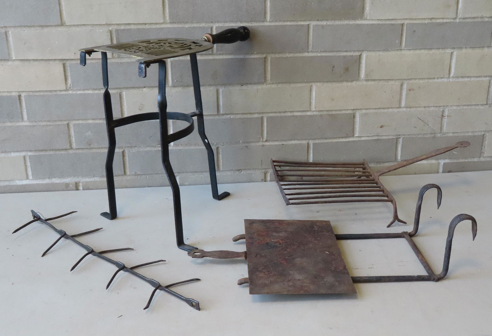 Grouping of mostly early iron country hearth items including: An early 19th century hanging hearth (1 of 6)