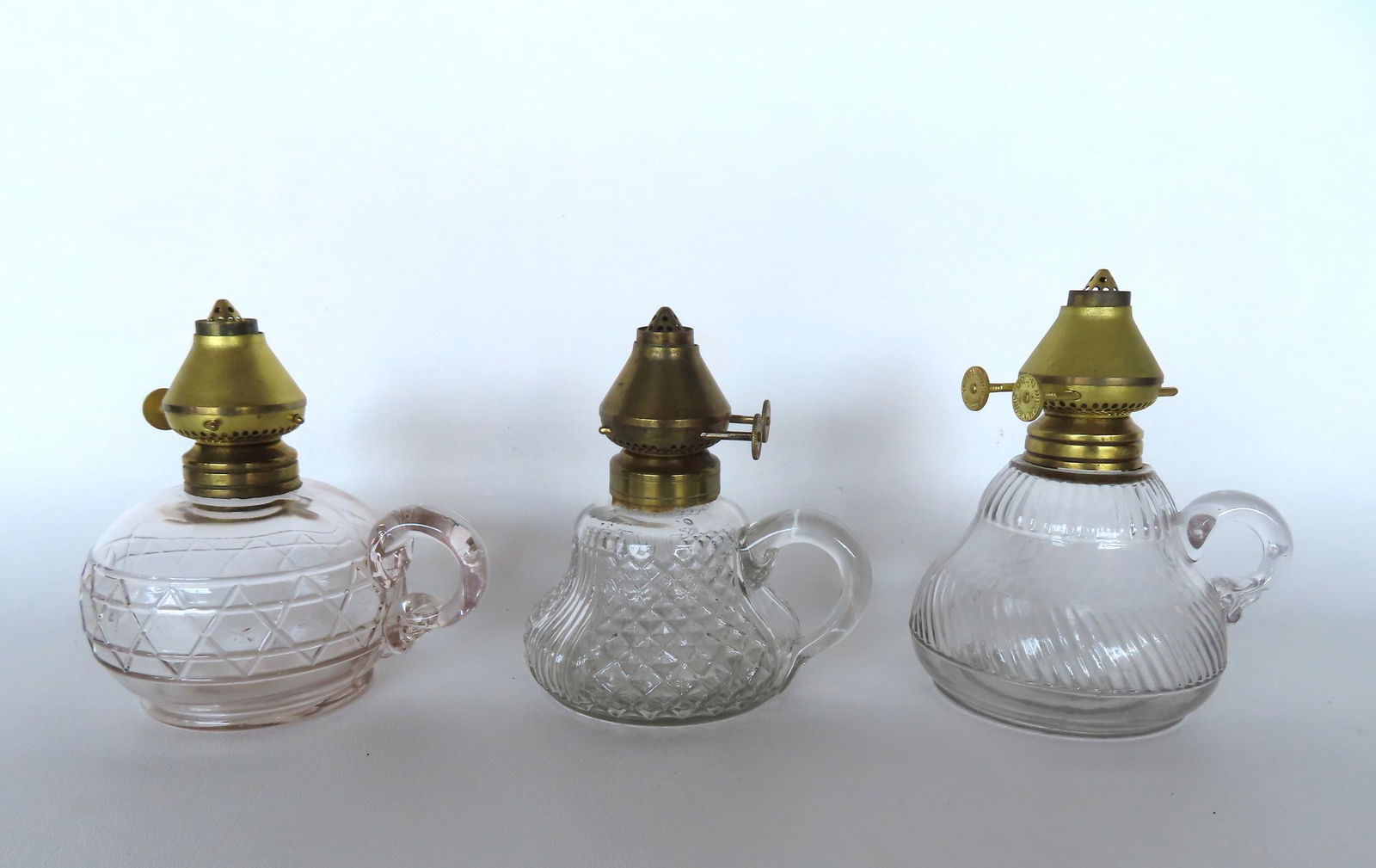 Three oil lamps with unusual burners and applied finger holders, 2 hand blown (1 with scarred (1 of 3)