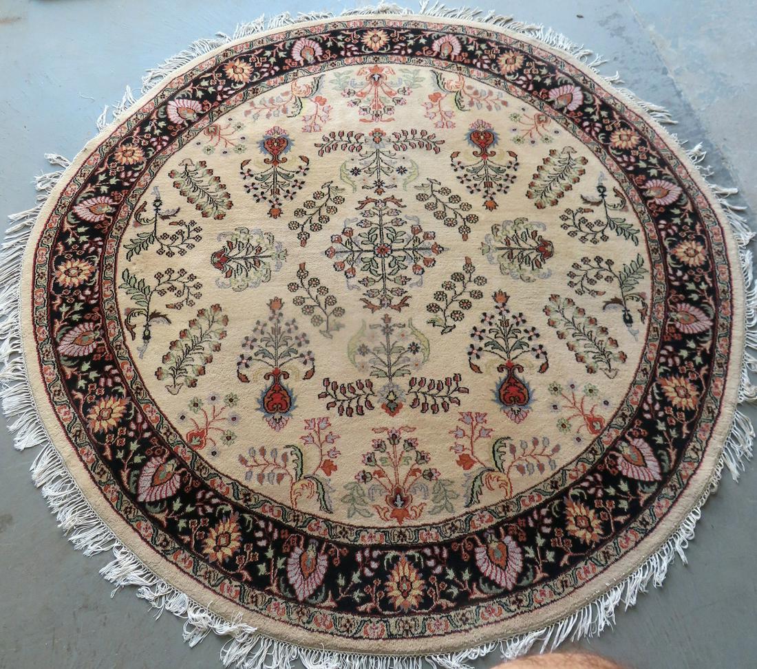 A round oriental room size hand woven rug, mid to late 20th century, slight loss to fringe, else (1 of 5)