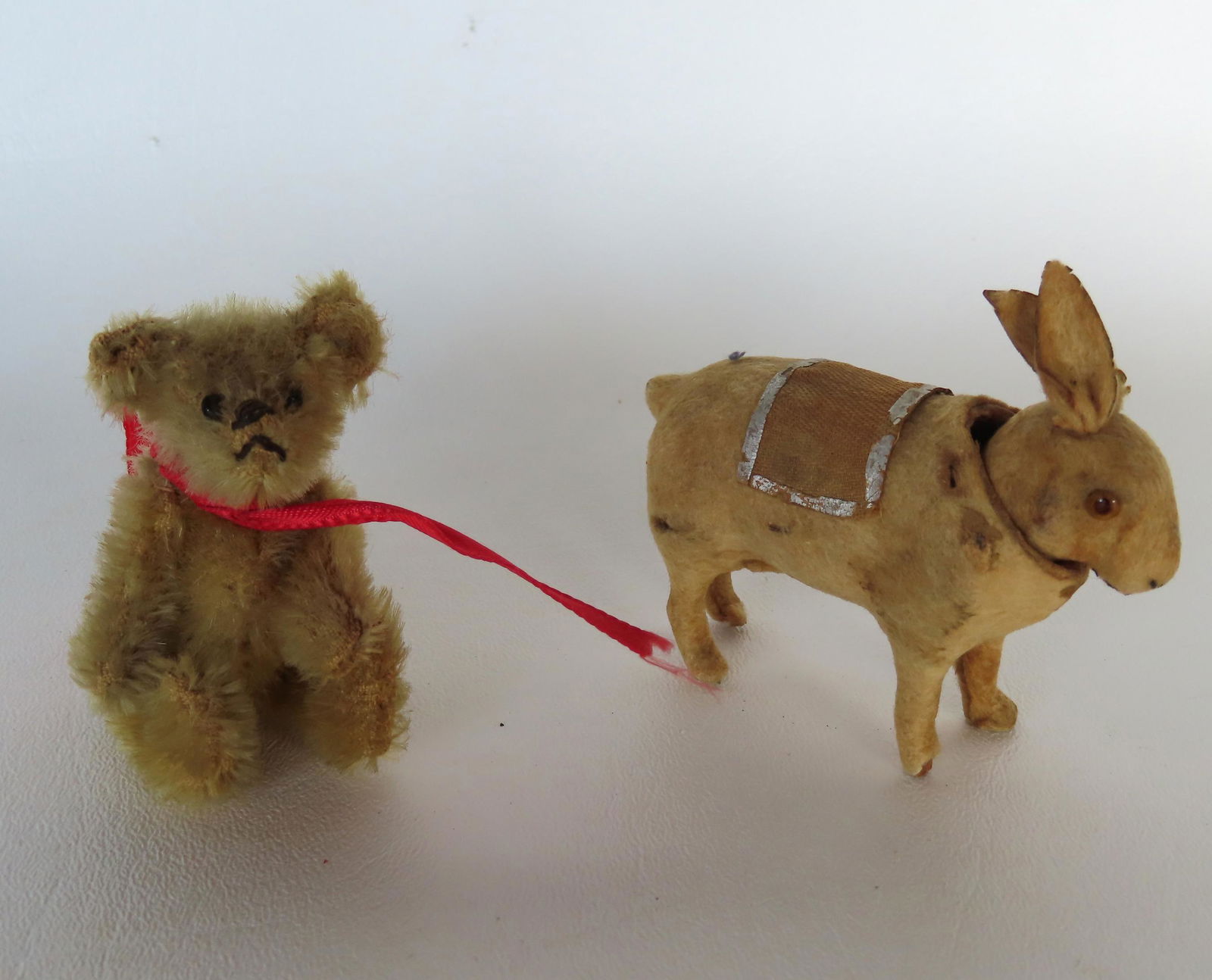 Two miniature holiday animals. The first, a  jointed mohair Steiff Teddy Bear with original button (1 of 15)