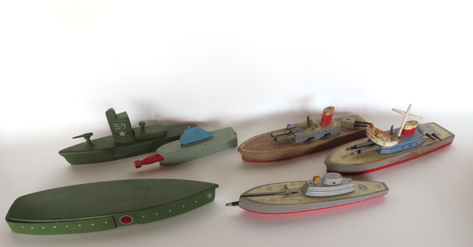 Grouping of 6 wooden toy military ships with bullet or torpedo launchers that shoot wooden (1 of 14)