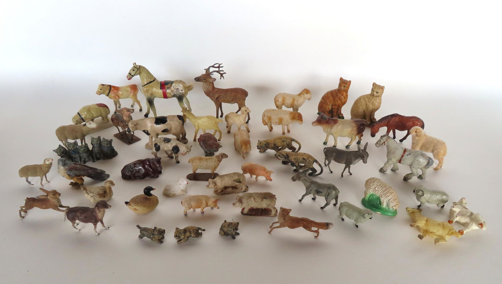 A large grouping of 45 miniature toy animals, domestic, farm and wildlife. Includes paper mache (1 of 15)