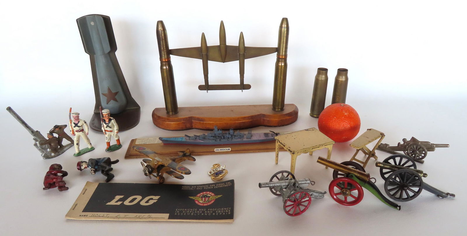 Grouping of vintage toys including: Shell art display of WWII bomber; cast iron soldier figures and (1 of 16)