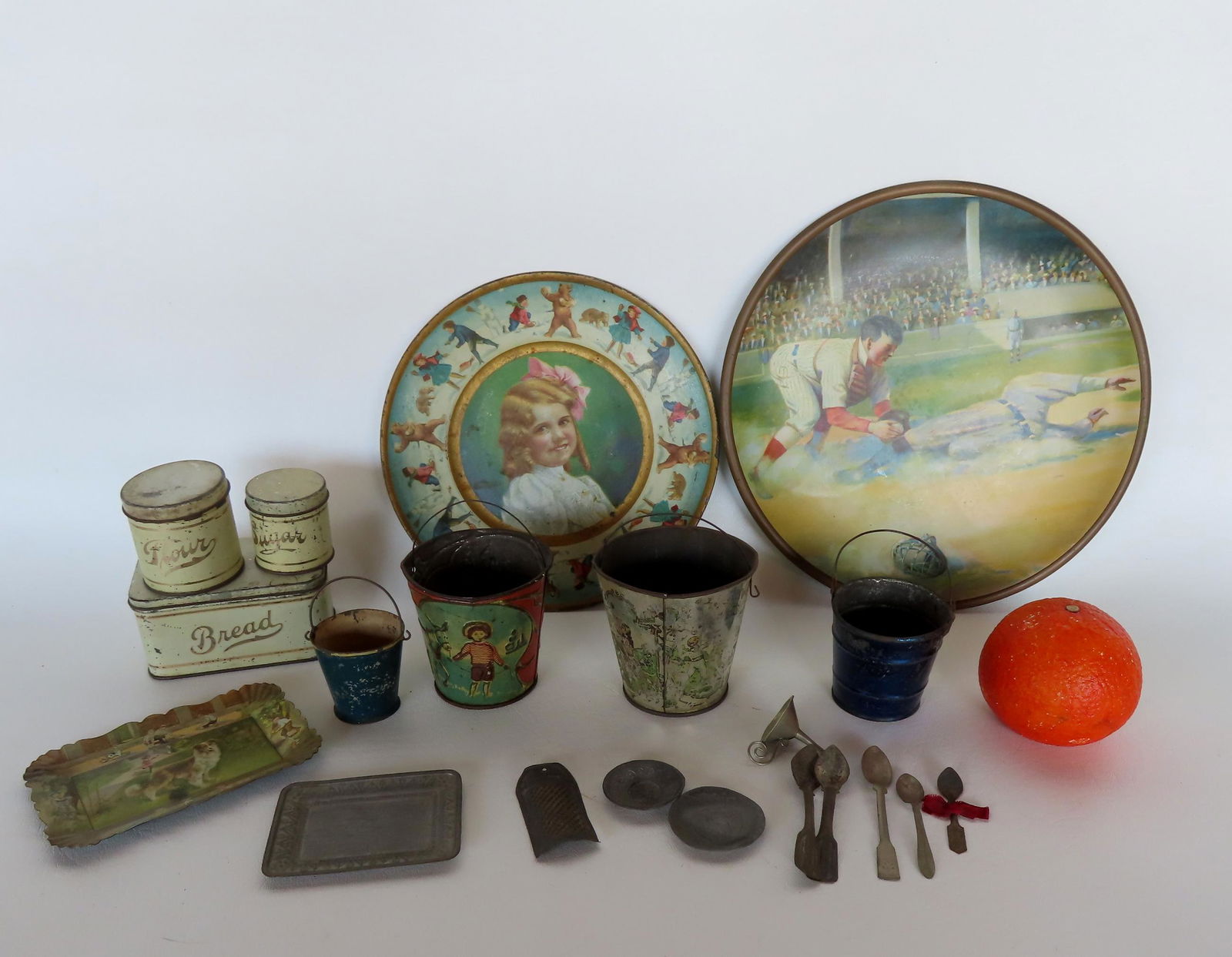 Grouping of early child's tinware including: 4 pails with wire bale handles, ranging in size from 1 (1 of 7)