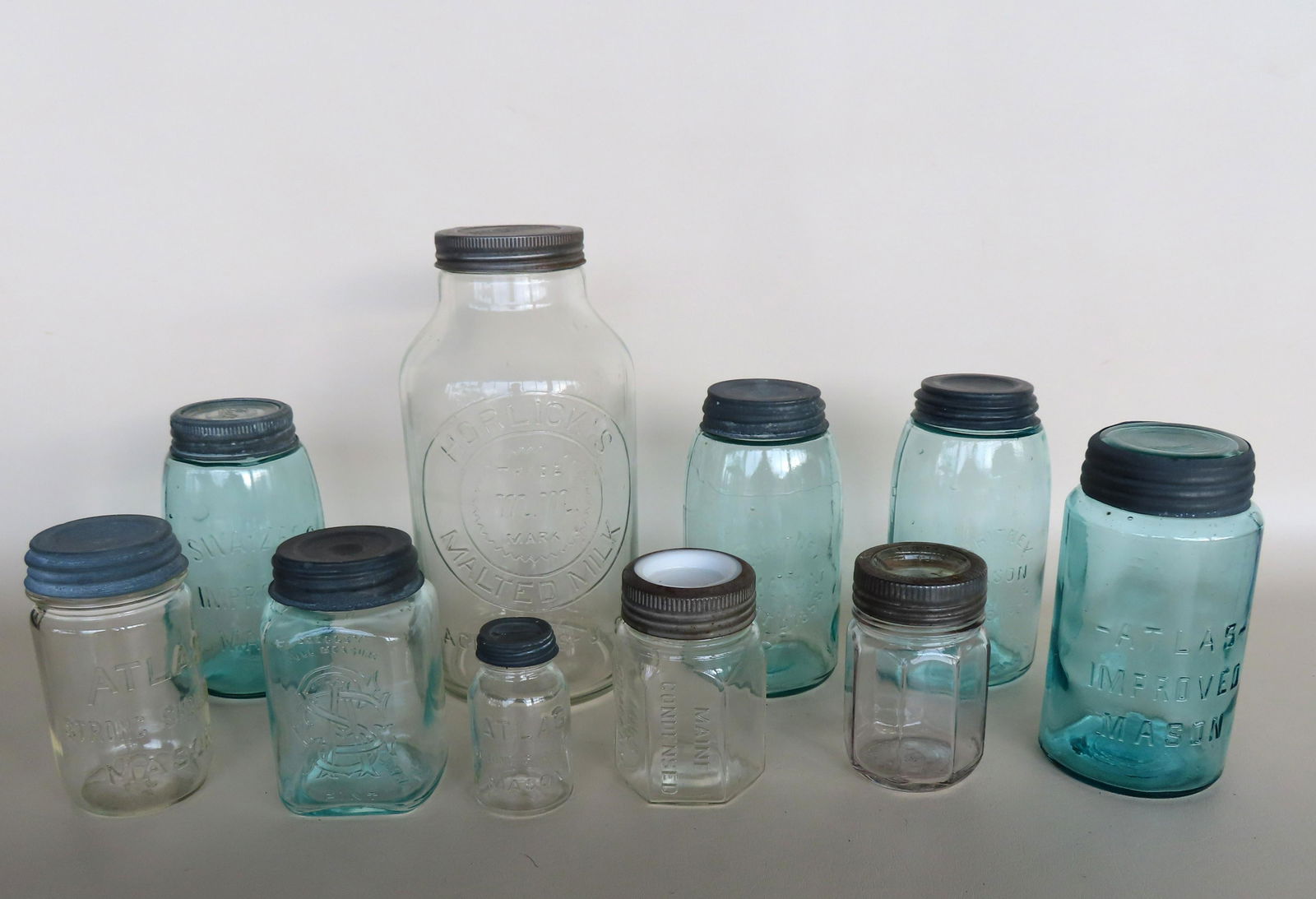 A grouping of 10 fruit, canning and milk jars including: "Horlick's Malted Milk" - 10 3/4"H; six (1 of 15)