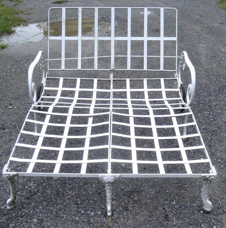 Iron double chaise lounge with retractable metal bon: Iron double chaise lounge with retractable metal bonnet which is currently not attached to the lounge itself (NOTEs: Chaise comes with cushions - canvas on bonnet needs to be replaced)