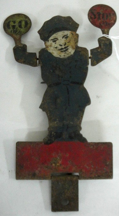 Early hand-painted tin shooting target of policeman: Early hand-painted tin shooting target of policeman holding Stop & Go sign in original paint