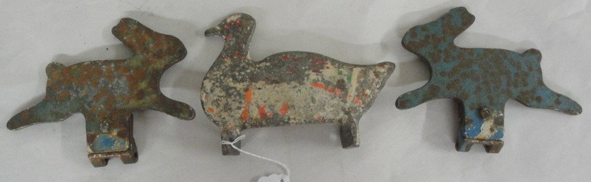 Three ca. 1900 cast iron carnival .22 caliber shoo: Three ca. 1900 cast iron carnival .22 caliber shooting targets in original paint inc. two running rabbits and one swimming duck
