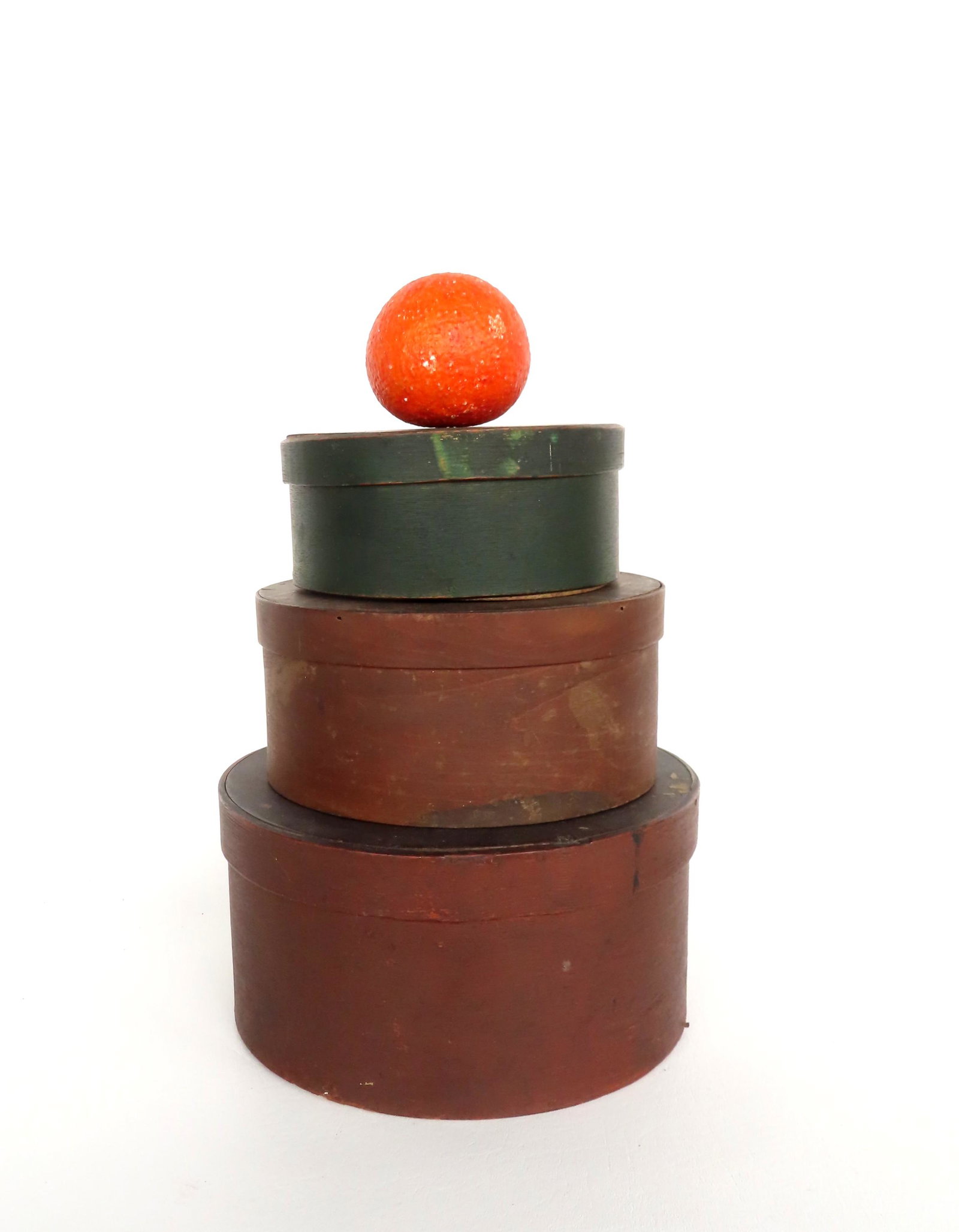 Three painted pantry boxes including 1 red, 1 reddish brown, and 1 in green, 19th century, all in: Three painted pantry boxes including 1 red, 1 reddish brown, and 1 in green, 19th century, all in original paint/stain and in good condition. Ranging in size from 6 1/2" diameter x 3"H to 9 1/2" diame