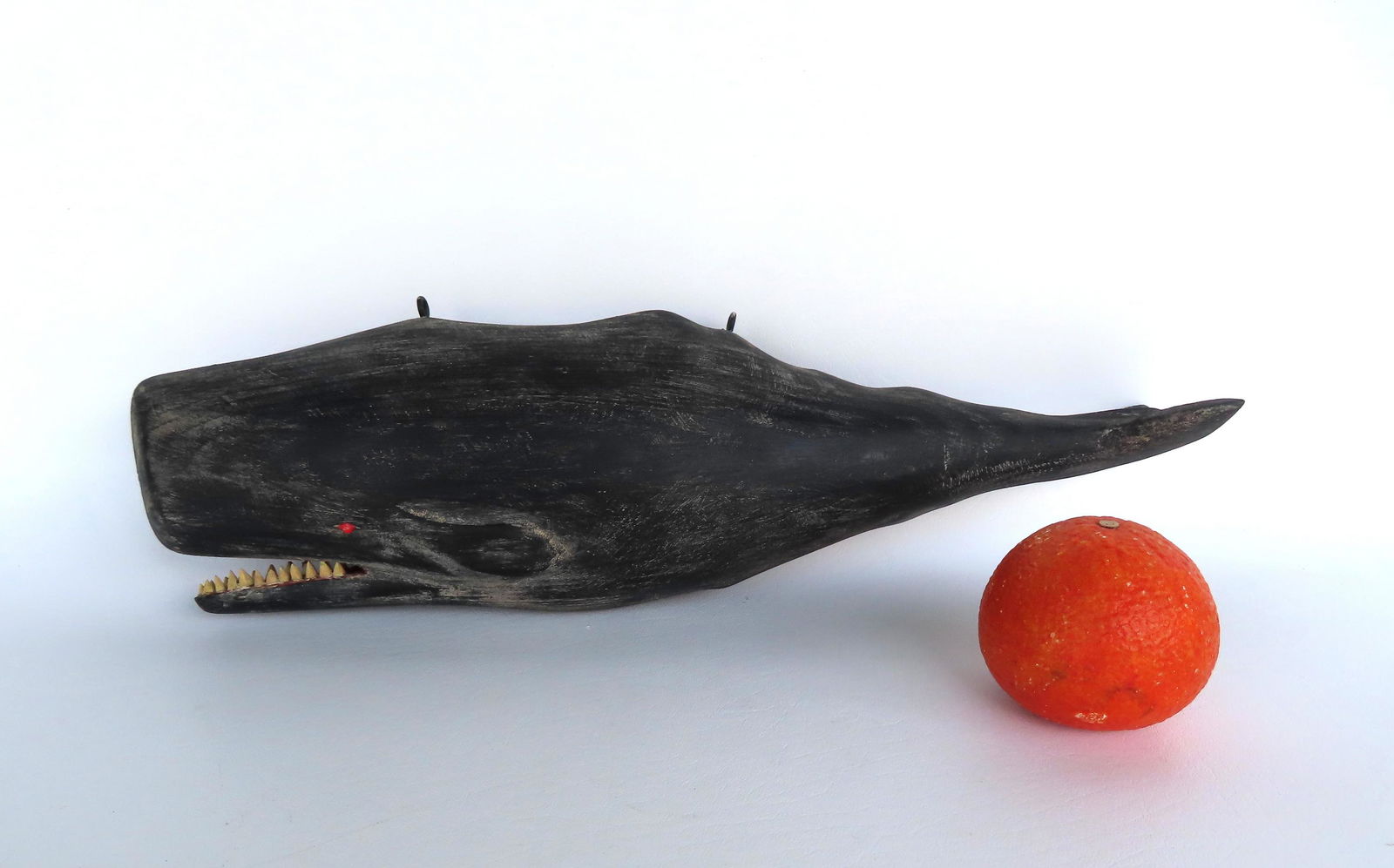Folk art carved full body sperm whale sculpture stamped C. Voorhees.: A folk art carved full body sperm whale wooden sculpture in original paint, with the impressed mark of C. Voorhees (but lacking his triangular symbol) - sold in the manner of Clark G. Voorhees Jr., ac