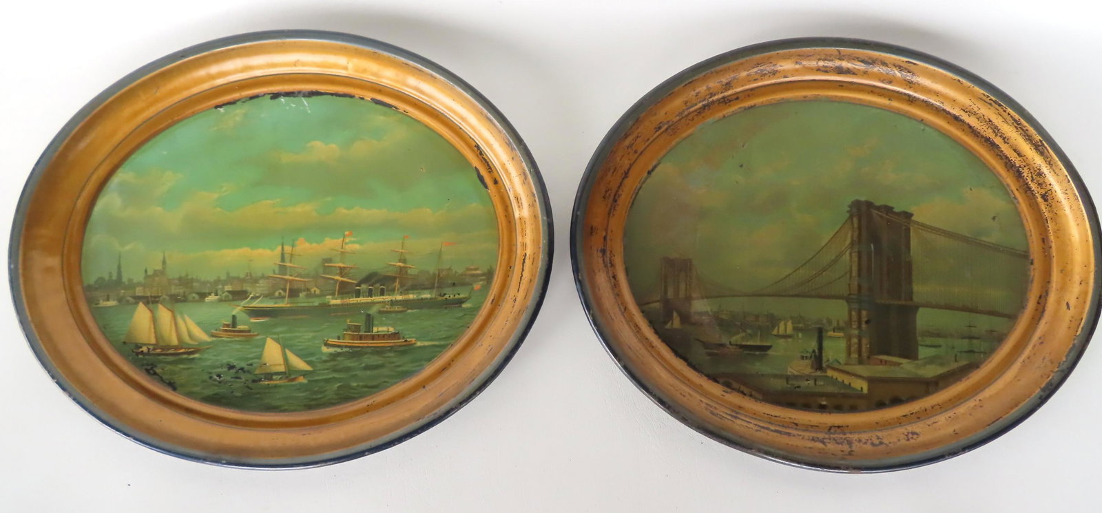 Two rare lithograph trays of the Brooklyn Bridge and vicinity with sailing ships in river. Each: Two rare lithograph trays of the Brooklyn Bridge and vicinity with sailing ships in river. Each measure 16" x 13" - some paint flaking but overall good condition. Circa 1880-90. Possibly commemorative