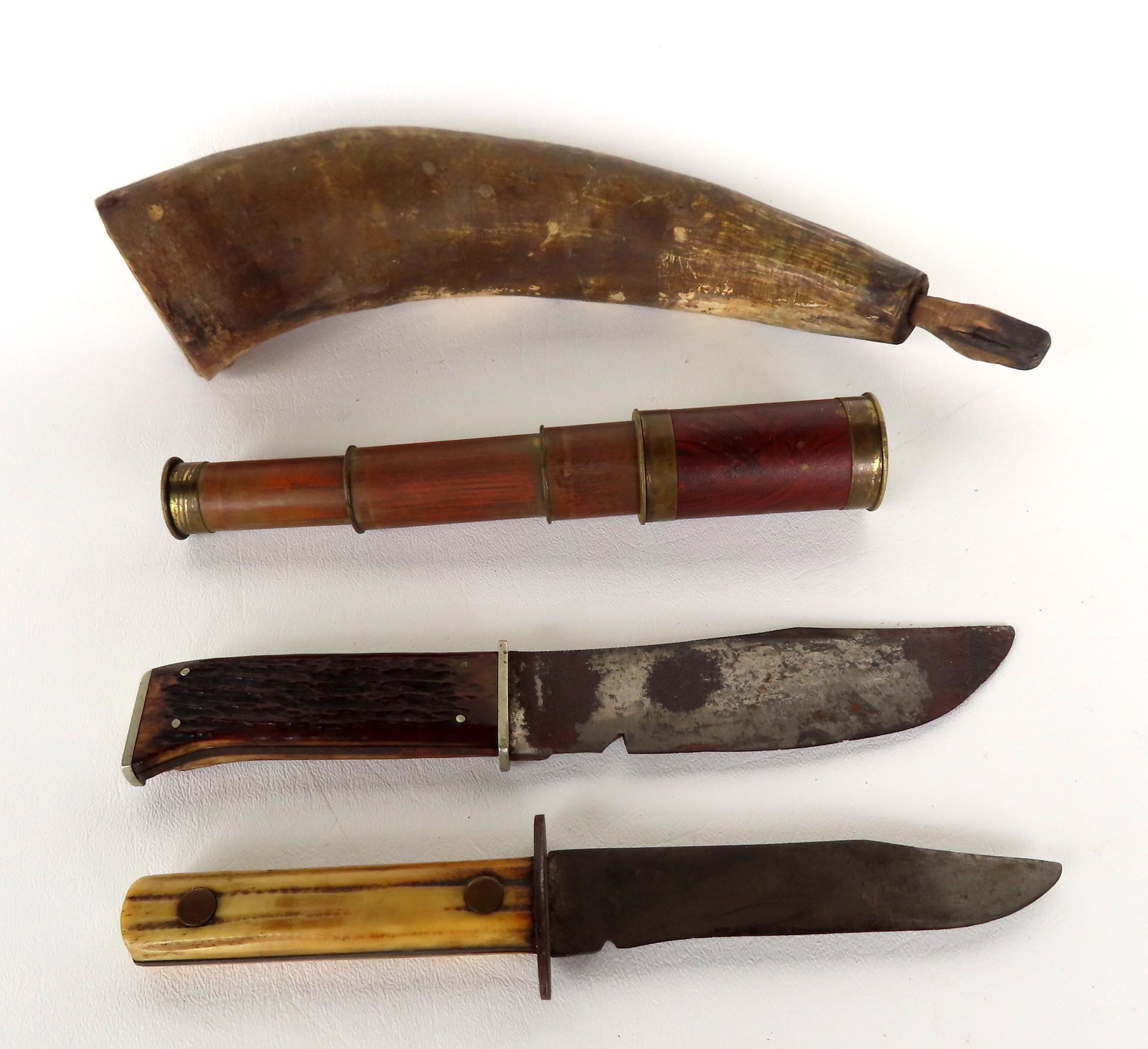 A grouping of hunting related collectibles including: Fishing knife with animal horn handle signed: A grouping of hunting related collectibles including: Fishing knife with animal horn handle signed Union Cutlery Co. Olean N.Y. - small chip to edge of blade, else good condition - no sheath - measure