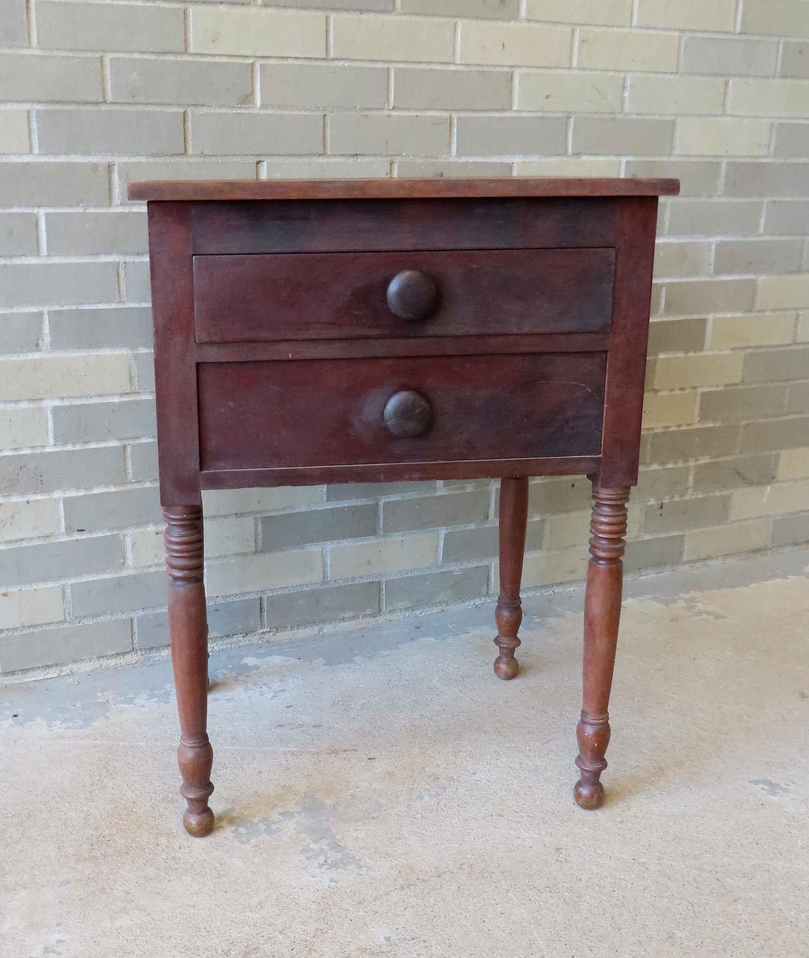 A Sheraton 2 drawer cherry & mahogany work table with turned legs that appears to retain original: A Sheraton 2 drawer cherry & mahogany work table with turned legs that appears to retain original finish, circa 1830. Good condition. Measures 21 1/2"W x 16 1/2"D x 31"H. Provenance: The Mark Vail col