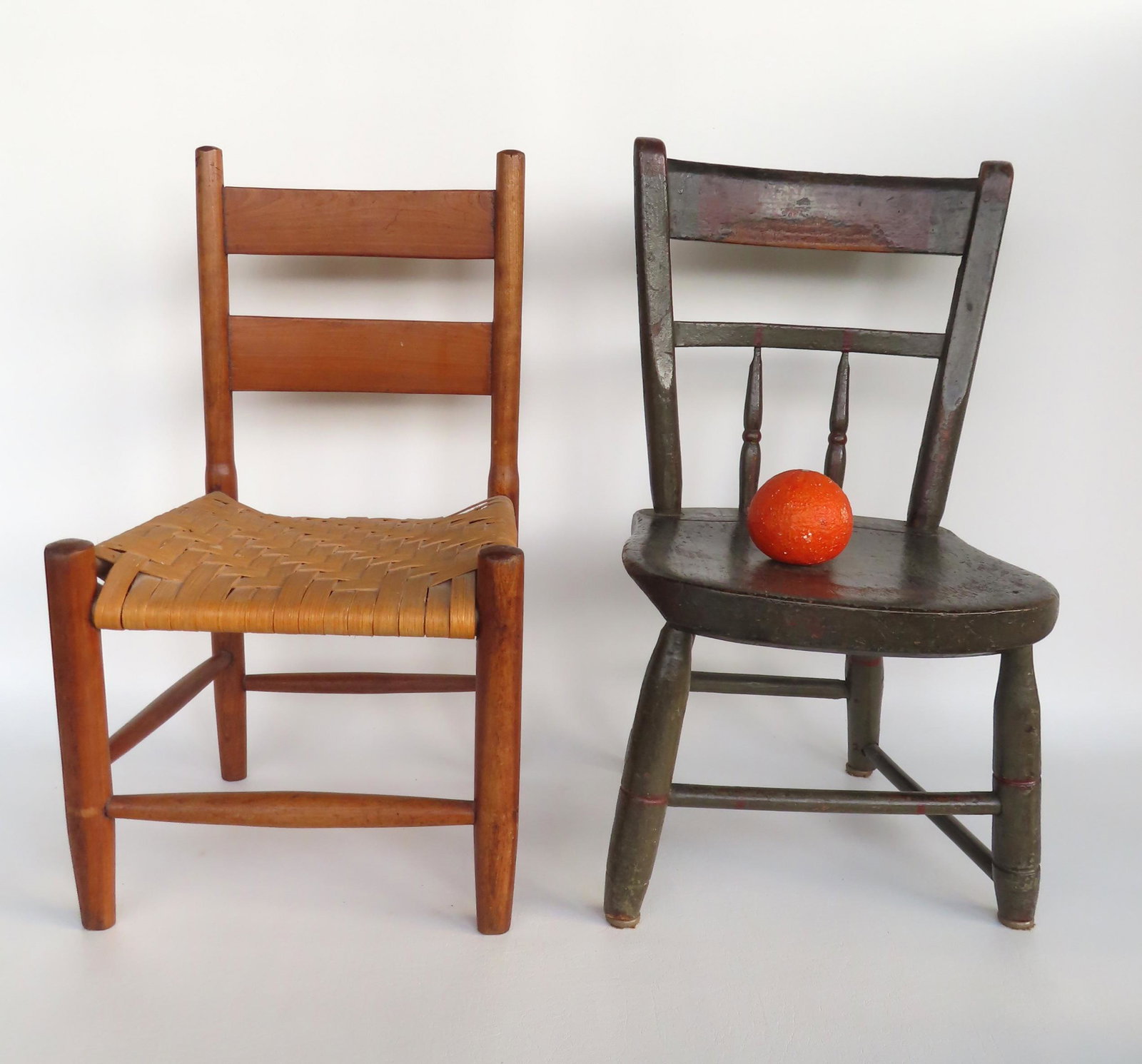Two early child's chairs, early 19th century. The first a ladder back chair with new woven cane seat: Two early child's chairs, early 19th century. The first a ladder back chair with new woven cane seat - very good refinished condition; and the second a Sheraton chair in old green paint that appears t