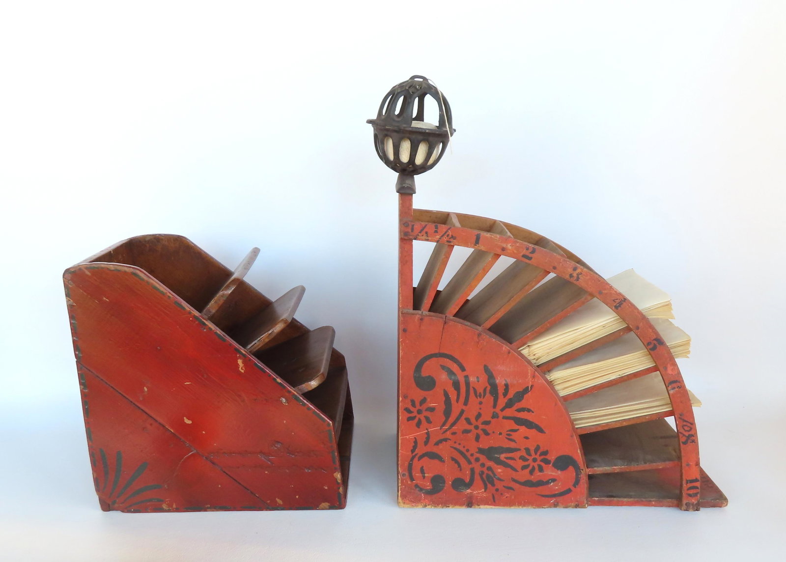 Two hard to find country store wooden sectioned bag holders, late 19th century, in original red: Two hard to find country store wooden sectioned bag holders, late 19th century, in original red paint and stenciling. The larger, also with a cast iron string holder mounted on the top, is signed Pat.
