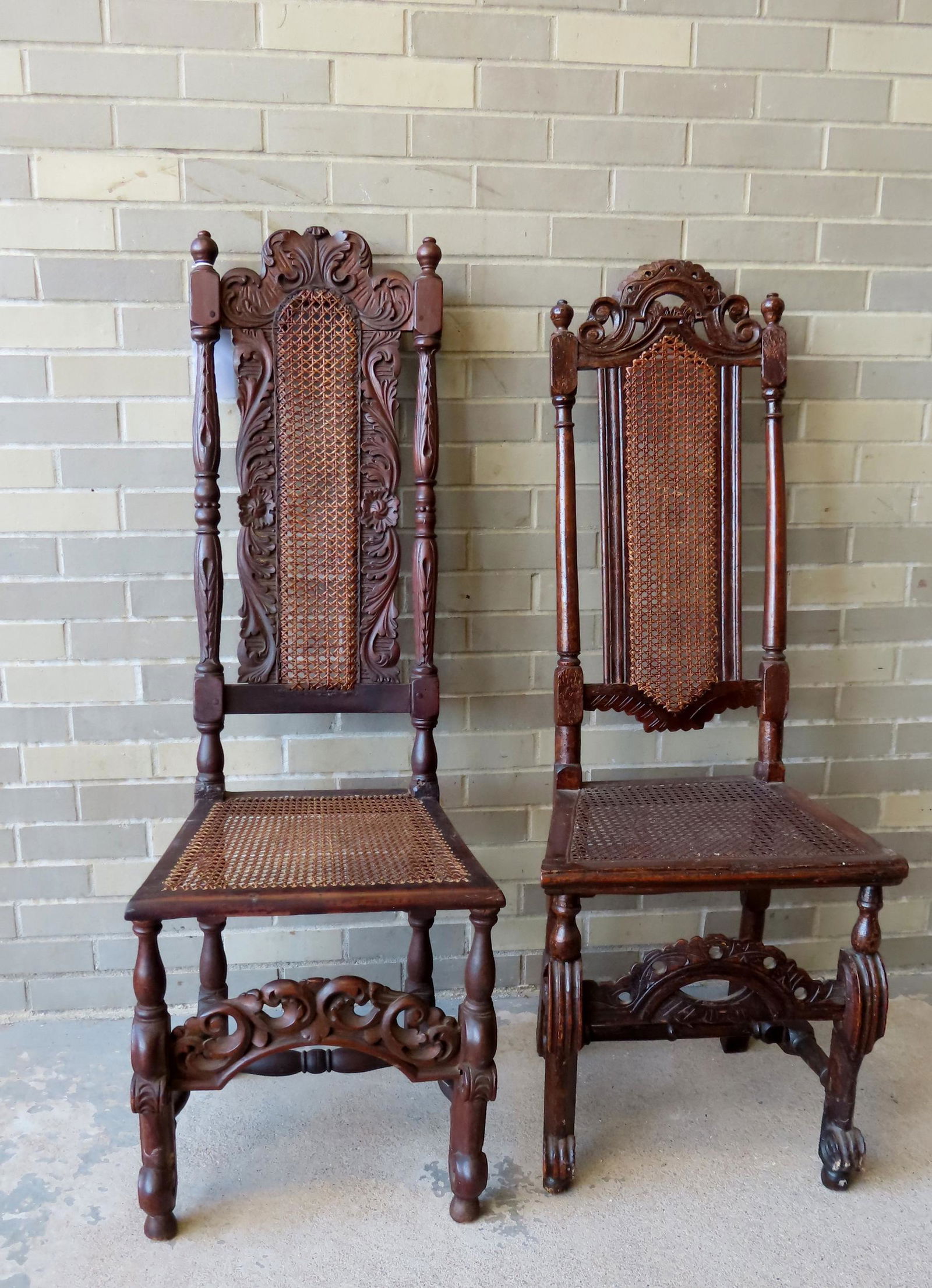 Two William & Mary period chairs, non-matching, with cane seats and back, extensive carvings on: Two William & Mary period chairs, non-matching, with cane seats and back, extensive carvings on crest, stiles, and aprons - each with cross stretchers and scrolled feed that are original. One chair wi
