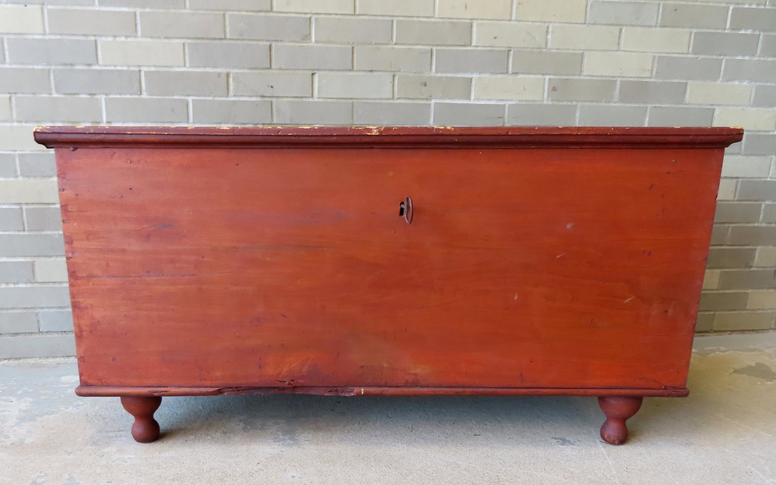 Early blanket box in original red stain, original scissor type lock with key typical of Mohawk: Early blanket box in original red stain, original scissor type lock with key typical of Mohawk Valley NY, chamfered cleats on underside of lid, original long hand forged strap hinges - feet are later 