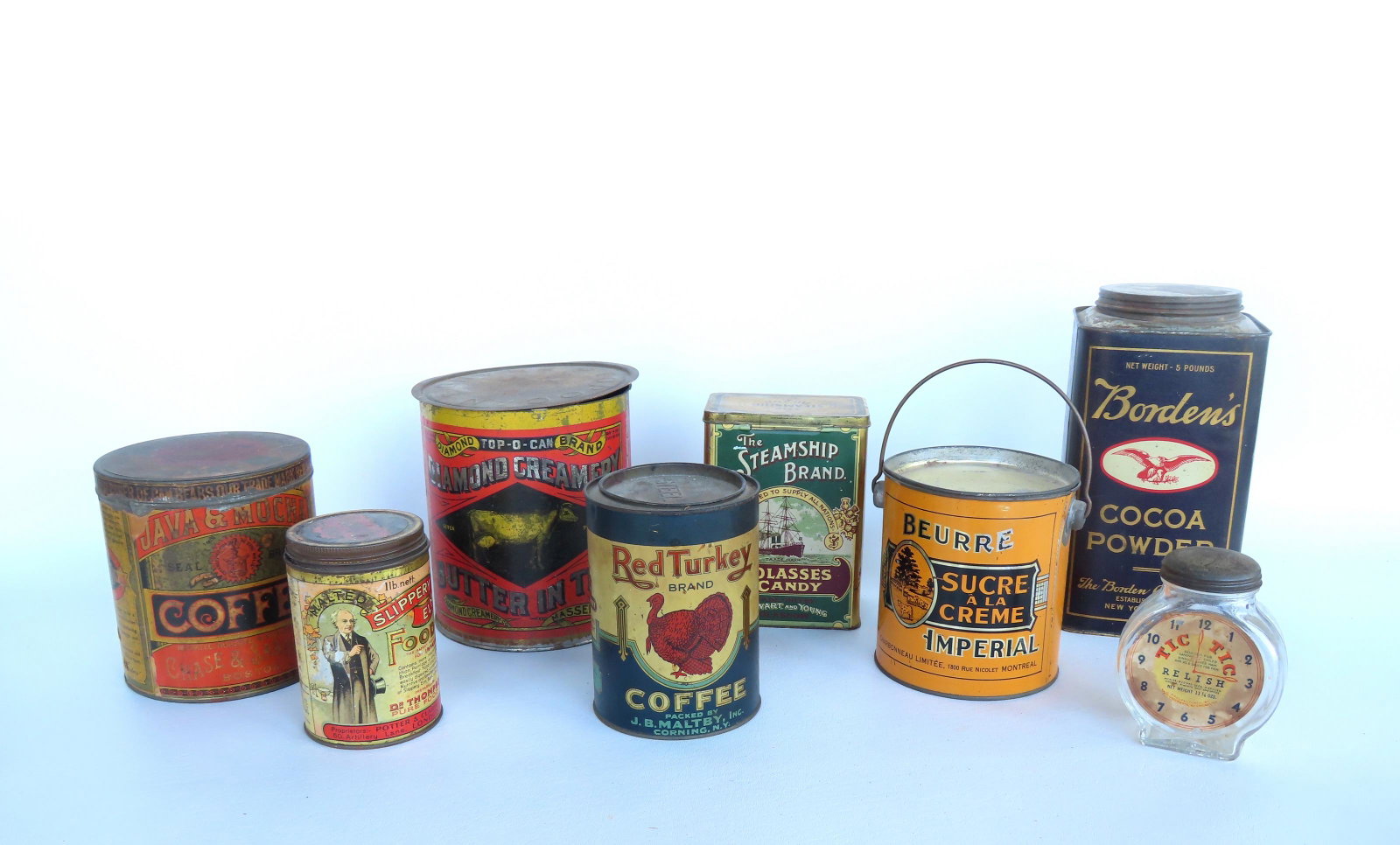 A grouping of 8 advertising tins/bottle, all late 19th to early 20th century in good condition. The: A grouping of 8 advertising tins/bottle, all late 19th to early 20th century in good condition. The largest measures 10 1/2"H x 5" square. Provenance: From the estate of Barbara Becker, High Falls NY.