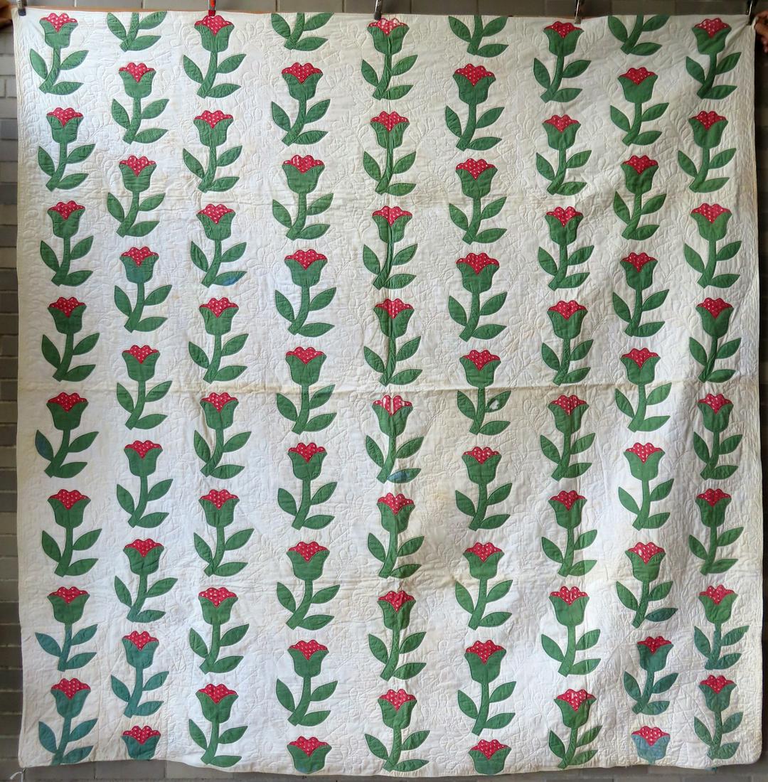 Applique floral quilt, pink and green flowers. Two corners with professional repairs (see images),: Applique floral quilt, pink and green flowers. Two corners with professional repairs (see images), minor fabric losses, and minor stains, overall good condition. Measures 91" x 92".