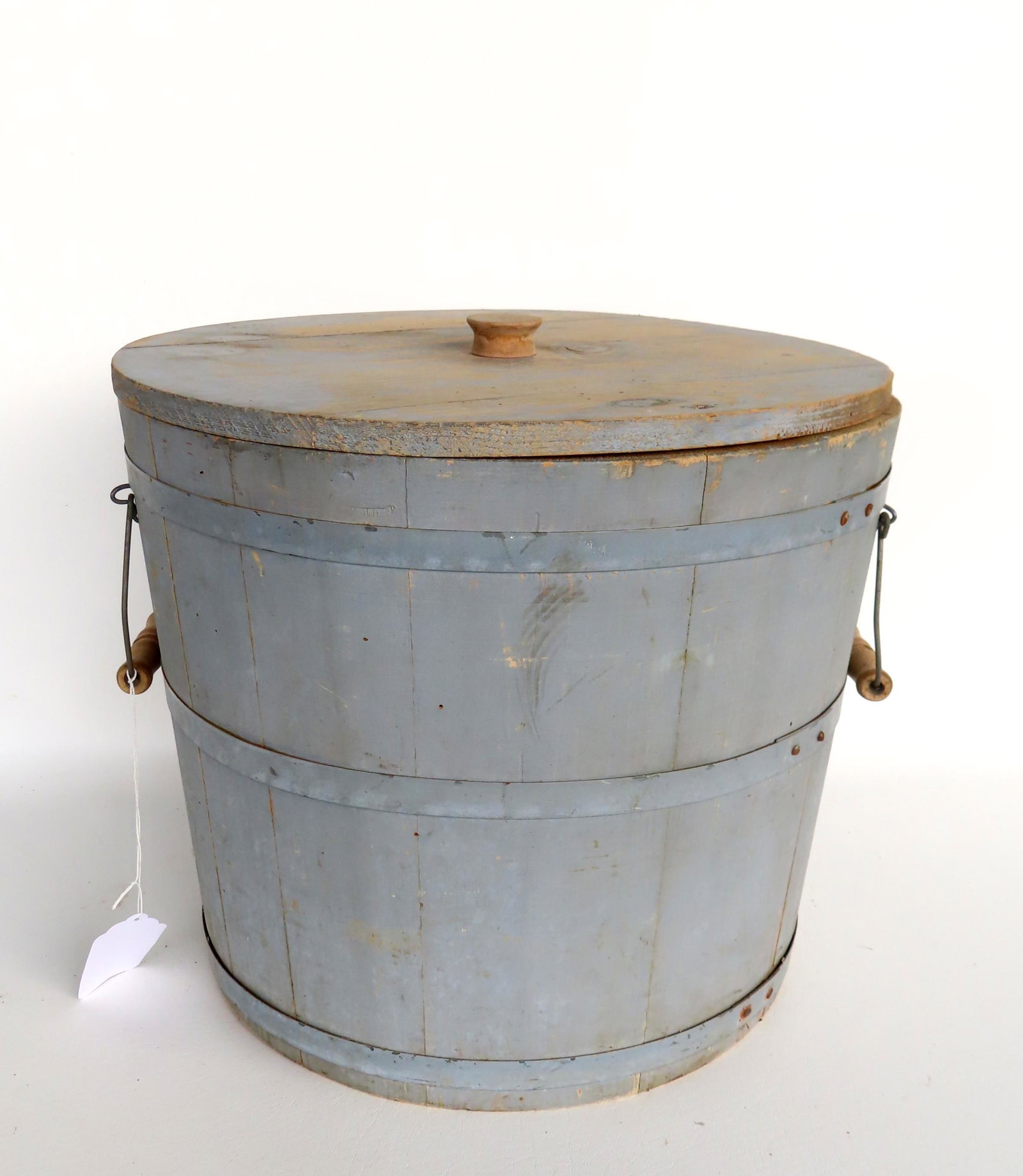 A lidded bucket in original robin's egg blue paint, late 19th century, having side bale handles.: A lidded bucket in original robin's egg blue paint, late 19th century, having side bale handles. Very good condition with slight use wear. Measures 17"W (to end of handles) x 15"H (top of lid finial).