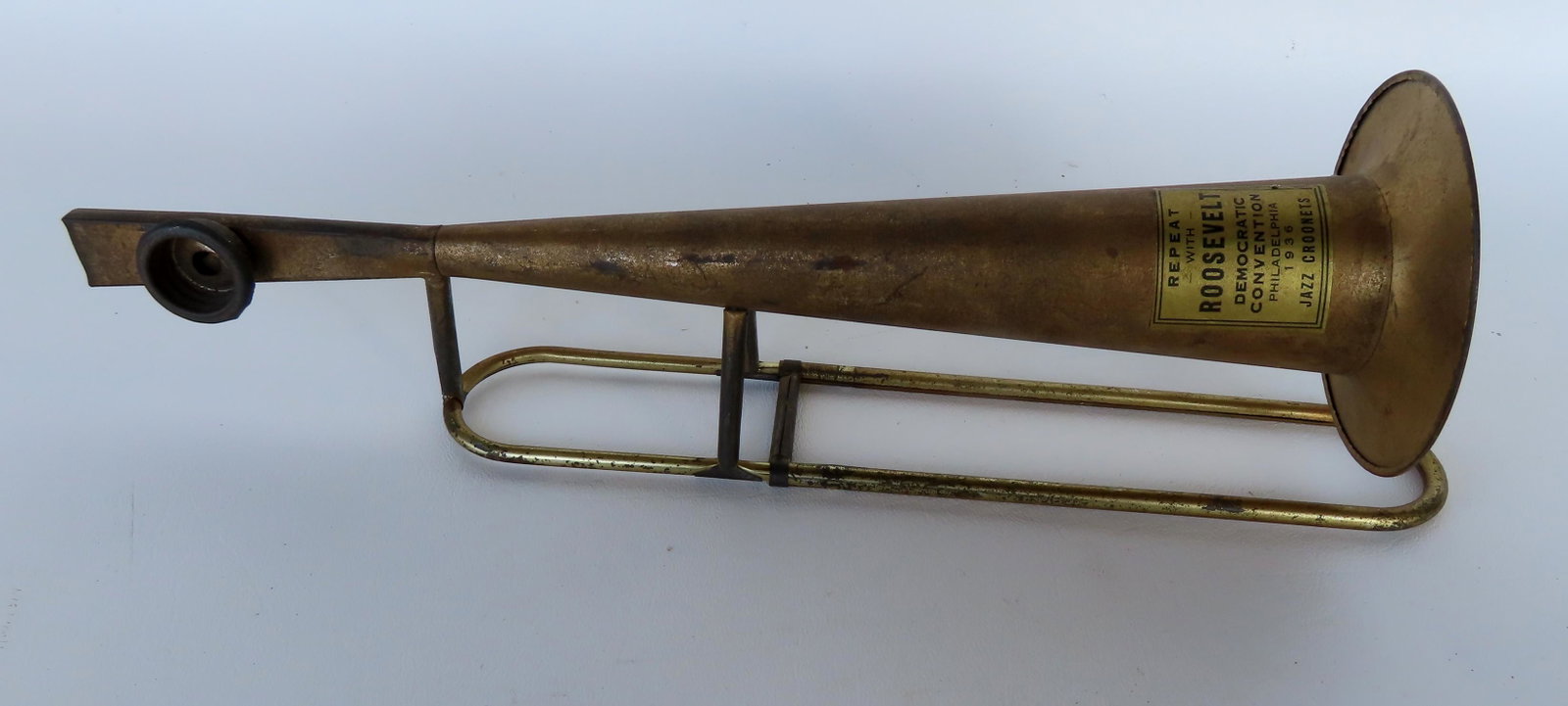 "Repeat with Roosevelt" horn from the 1936 Democratic Convention in Philadelphia.: A political horn from the 1936 Democratic Convention in Philadelphia, marked : "Repeat With Roosevelt / Democratic Convention / Philadelphia 1936 / Jazz Coronets" - minor losses to gilt finish and ove