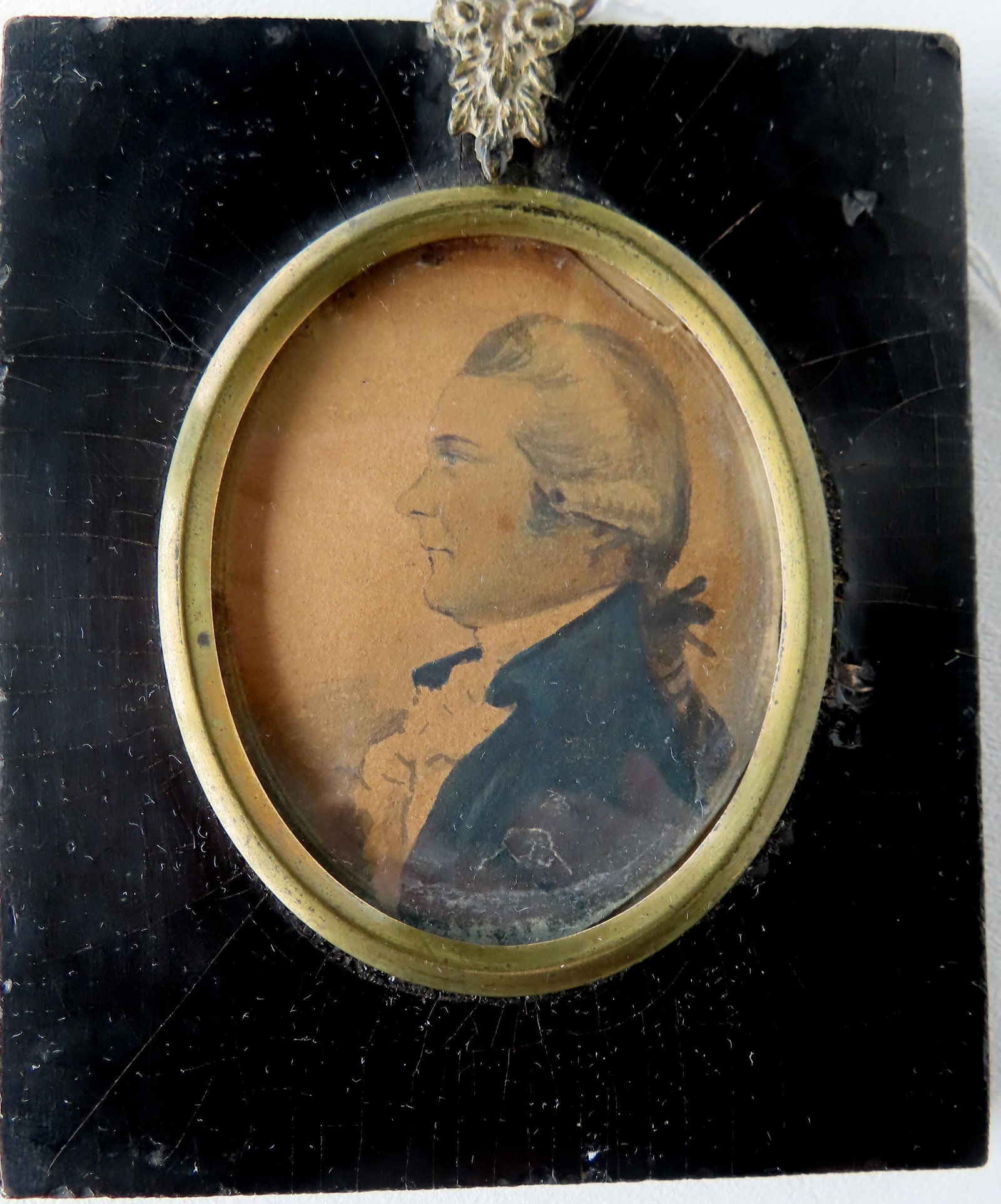 A miniature W/C on paper portrait of a stately gentleman bearing resemblance to Alexander Hamilton: A miniature W/C on paper portrait of a stately gentleman bearing resemblance to Alexander Hamilton in military dress, early 19th century, mounted in original frame that measures 4" x 4 7/8. Some crazi