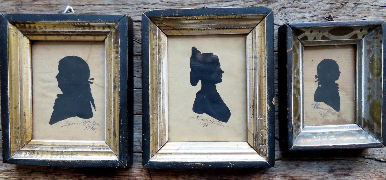Grouping of 3 silhouettes, Wilson Family, 19th century. Includes a matched pair of husband and wife: Grouping of 3 silhouettes, Wilson Family, 19th century. Includes a matched pair of husband and wife signed in ink "Nora and David Wilson 1794" - both in original gilt gesso matching frames - total fra