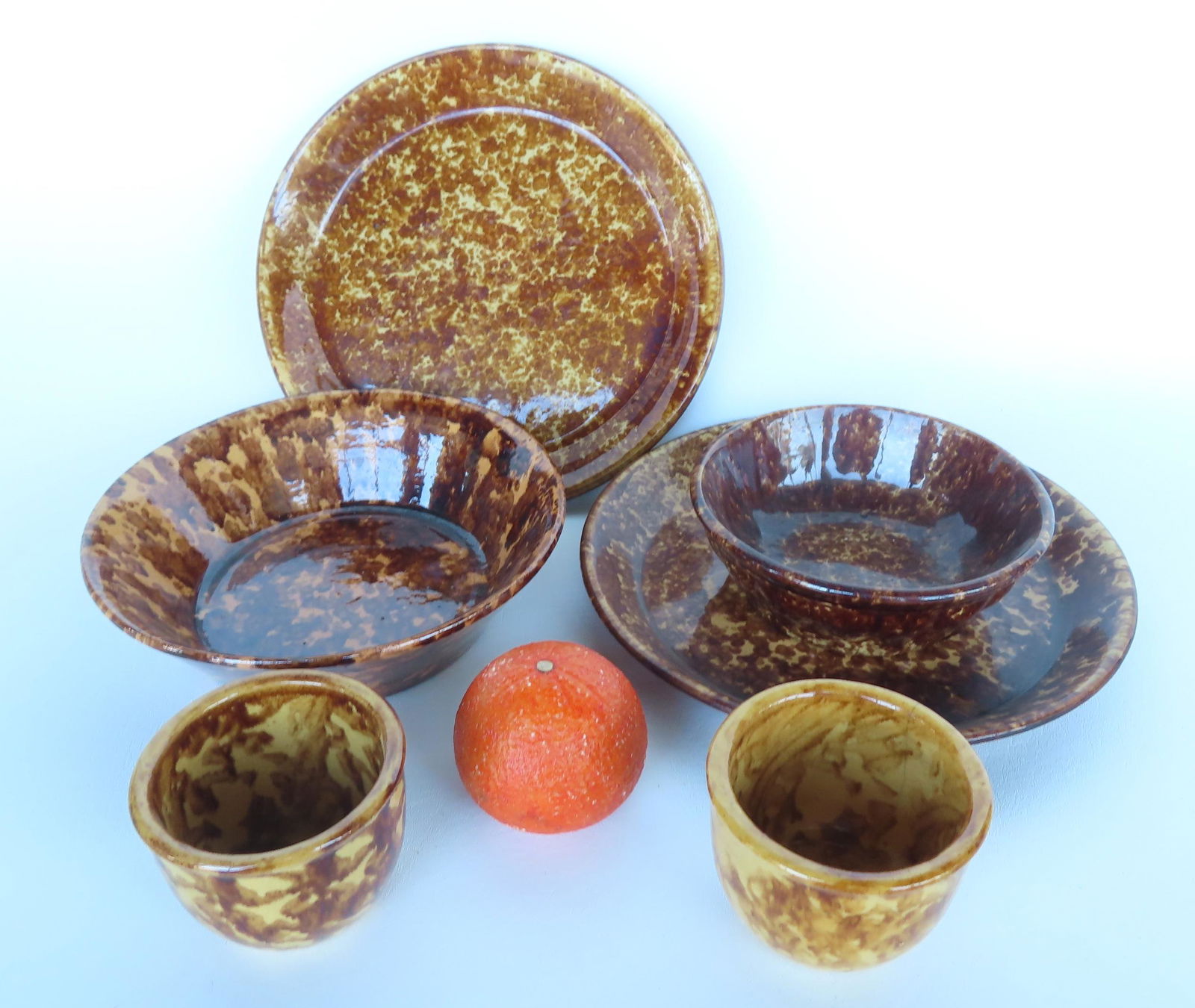 Grouping of 6 pieces of Bennington spongeware. Includes milk bowl - 8 3/4" x 2 1/2"H - several: Grouping of 6 pieces of Bennington spongeware. Includes milk bowl - 8 3/4" x 2 1/2"H - several glazing flakes on rim, else good condition; 2 pie plates, both in very good condition with no damage - 10