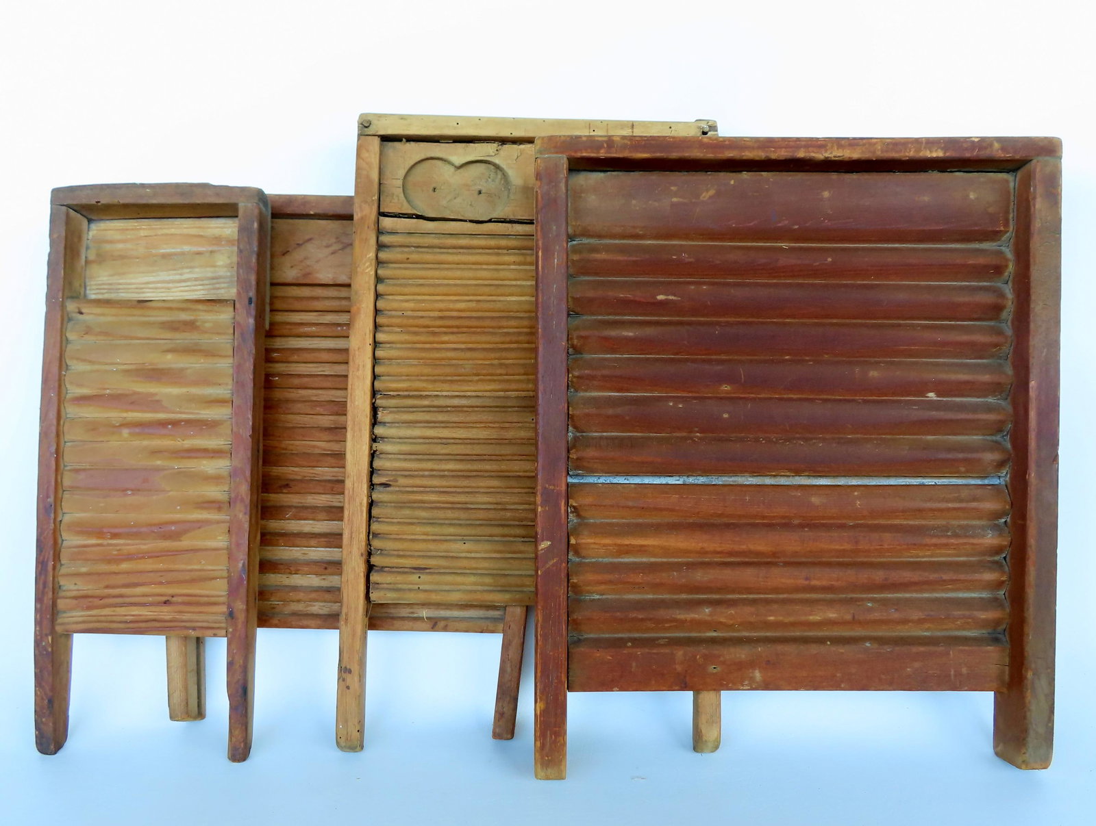 Six 19th century wooden washboards, good condition. The largest 17"W x 21"H. Provenance: From the: Six 19th century wooden washboards, good condition. The largest 17"W x 21"H. Provenance: From the estate of Barbara Becker, High Falls NY. This lot is part of her 60 year collection that she used to d