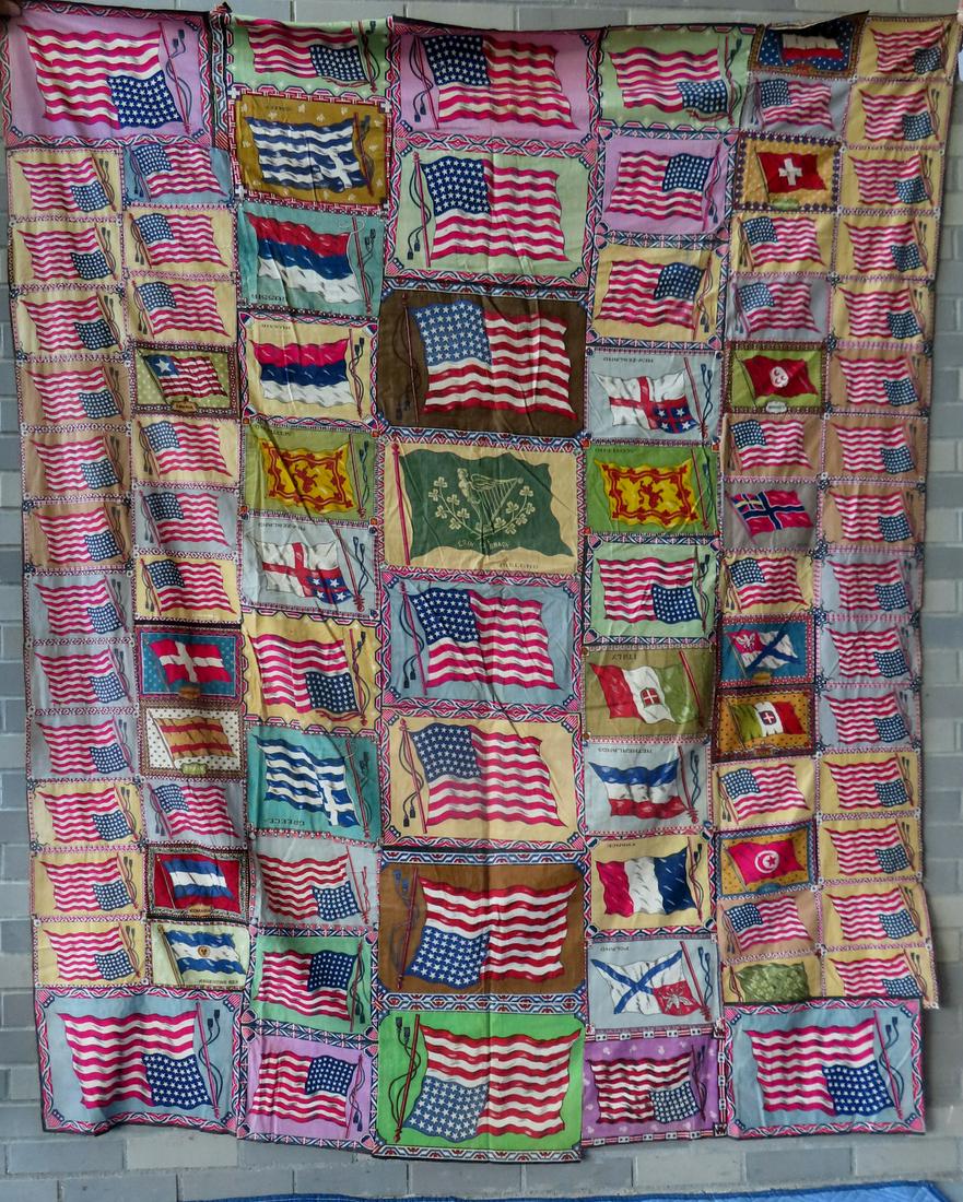 A felt flag quilt top, early 20th century, composed of various tobacco flag premiums hand sewn: A felt flag quilt top, early 20th century, composed of various tobacco flag premiums hand sewn together - includes both American and continental flags - very good condition. Measures 71" x 80".
