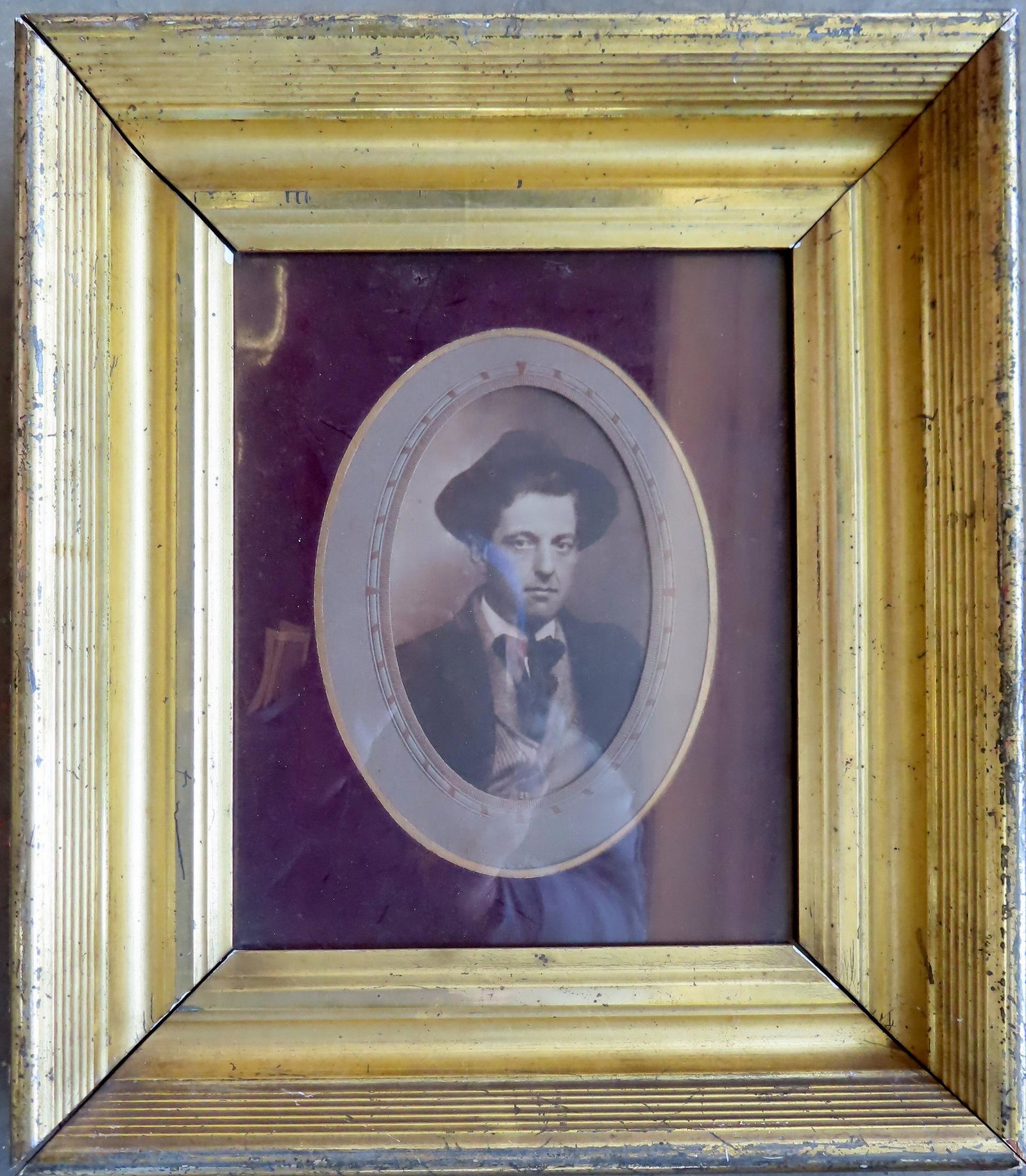 An early photograph of a gentleman, mounted in a good lemon gold frame, circa 1850. The frame with: An early photograph of a gentleman, mounted in a good lemon gold frame, circa 1850. The frame with some use wear, is in good condition - the frame holds an image measuring 8 1/4" x 10" and total frame