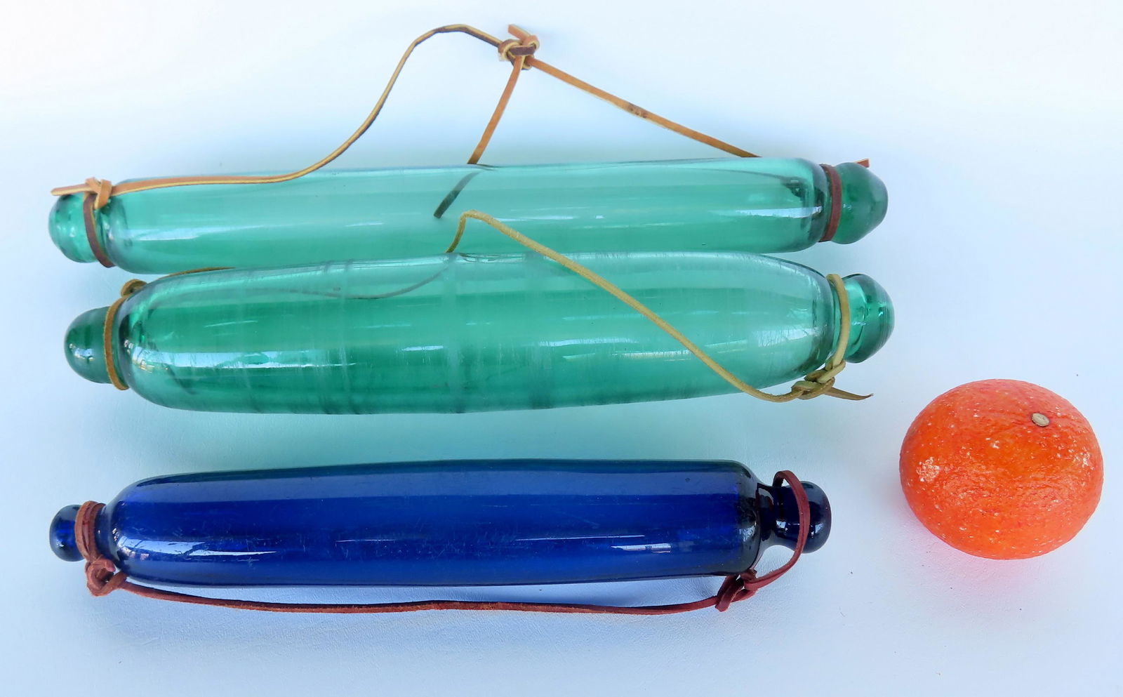 Three glass rolling pins, all with some surface abrasions due to use, but overall good condition: Three glass rolling pins, all with some surface abrasions due to use, but overall good condition with no other damage. The largest measures 17"L. Provenance: From the Doris and Jerry Soldner collectio
