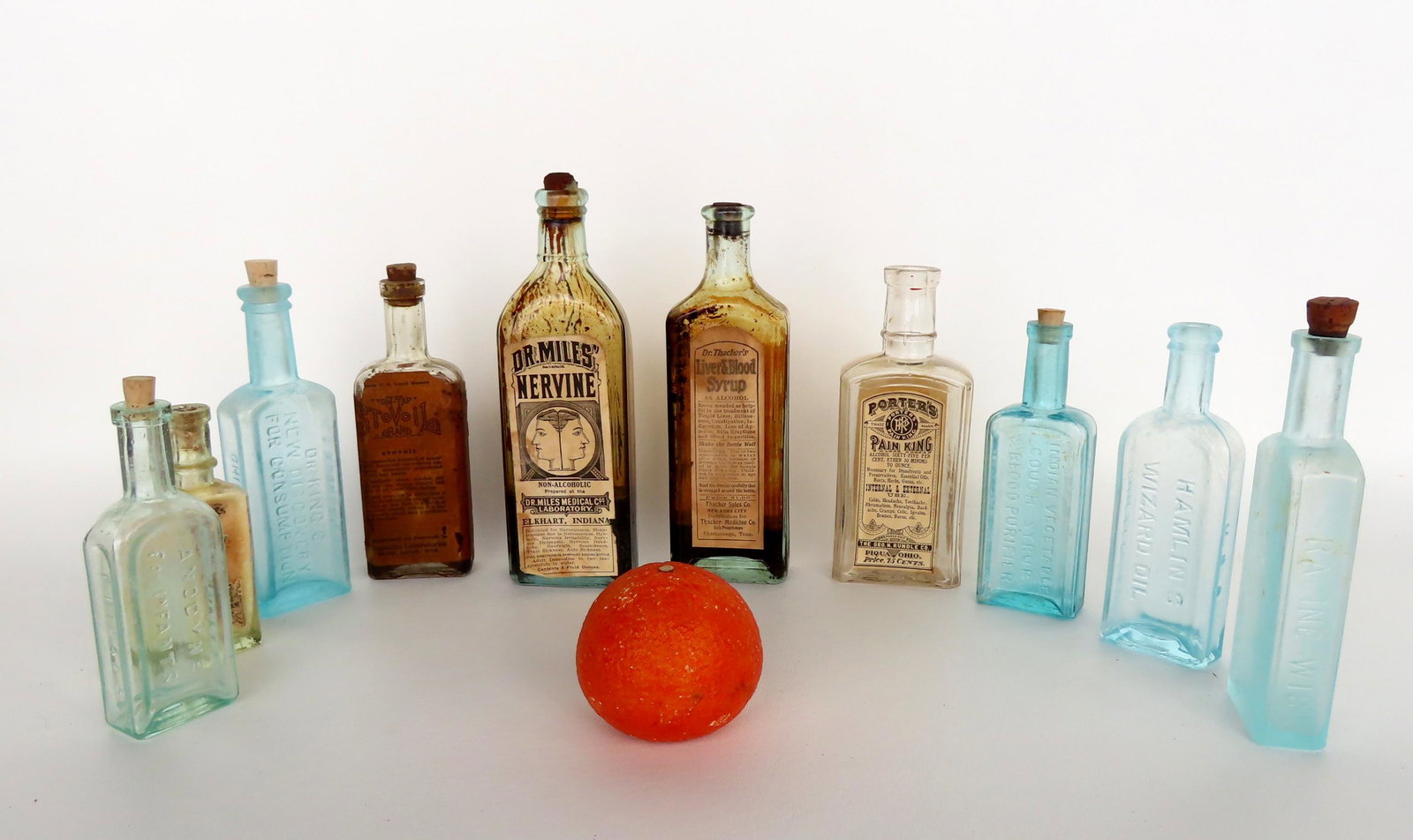 Grouping of 10 mostly medicinal bottles including: Dr. Miles Nervine, Porter's Pain King, Dr.: Grouping of 10 mostly medicinal bottles including: Dr. Miles Nervine, Porter's Pain King, Dr. Thacher's Liver & Blood Syrup, Hamlin's Wizard Oil, Indian Vegetable Cough Syrup & Blood Purifier, etc.