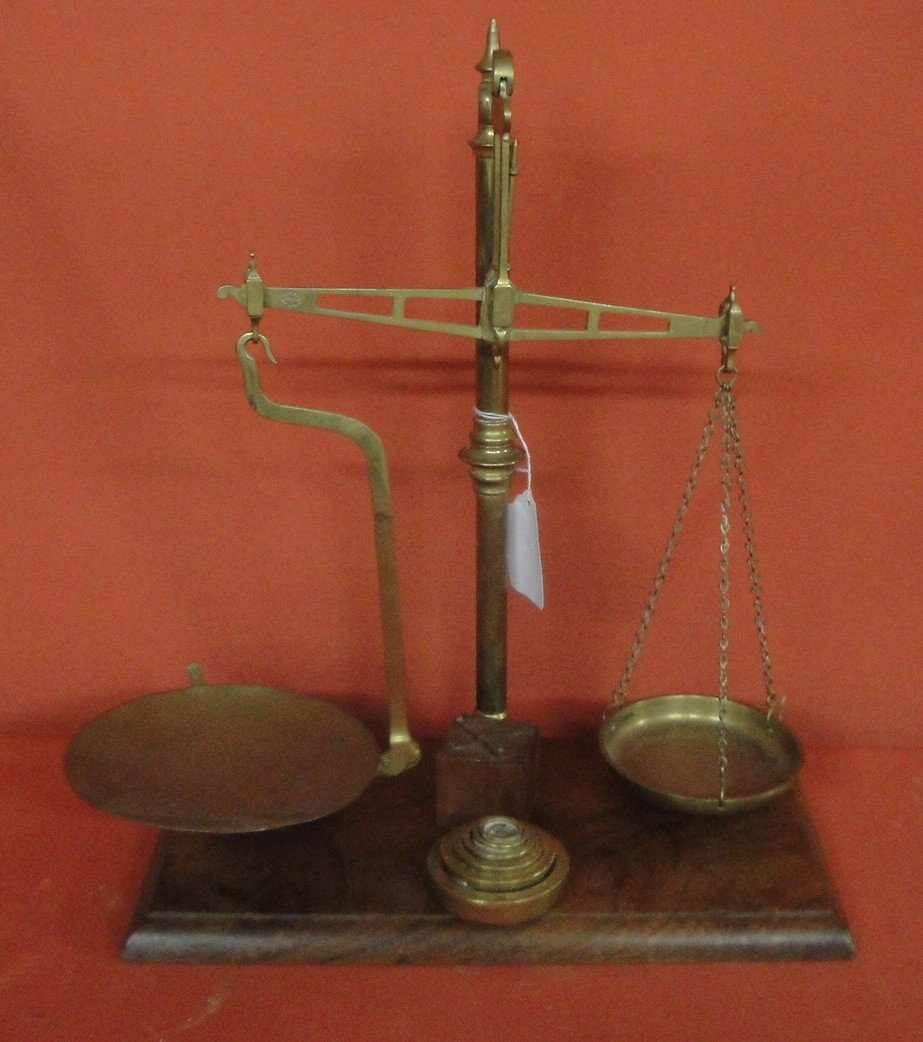19th c. brass balance scale on wooden base signed W: 19th c. brass balance scale on wooden base signed W & T Avery, Makers, Birmingham - with complete weight set