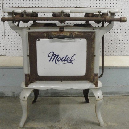 White enameled cast iron camp gas cook stove signed: White enameled cast iron camp gas cook stove signed Model with three burners - 32" high x 29" wide