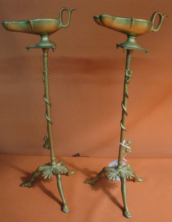 Two old Syrian brass oil lamps. Pedestal has dog c: Two old Syrian brass oil lamps. Pedestal has dog chasing snake up tree.
