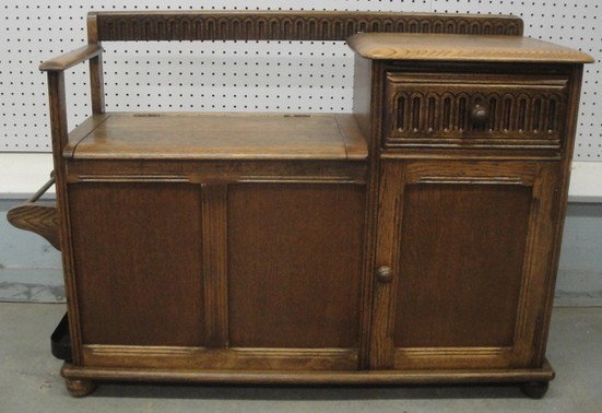 Oak hall chair with lift top seat exposing storage: Oak hall chair with lift top seat exposing storage area.