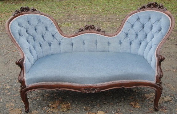 Beautiful Victorian double-end settee: Beautiful Victorian double-end settee with heavily carved black walnut rose carved back and carved cabriole legs. Newly reupholstered in blue velvet fabric. Tufted back. Circa 1860-70