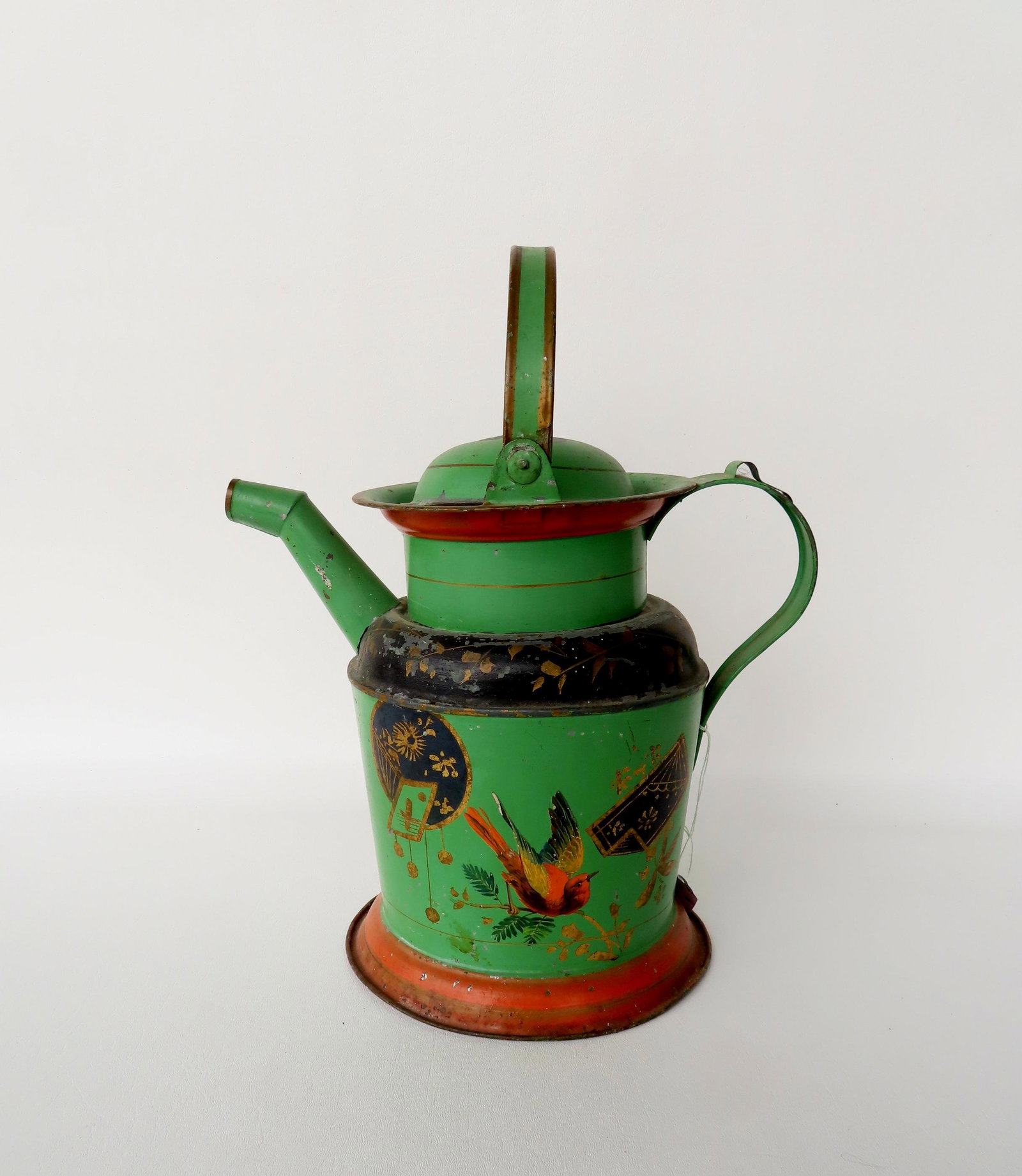 A Victorian era watering can with hand painted decorations including birds and flowers, 19th: A Victorian era watering can with hand painted decorations including birds and flowers, 19th century. Some paint wear, ding in side, overall good condition. Measures 13"W x 10"D x 16"H to top of handl