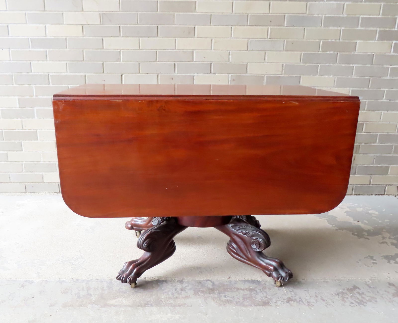 A high quality American mahogany drop leaf breakfast table above an apron with gilt and black (1 of 17)