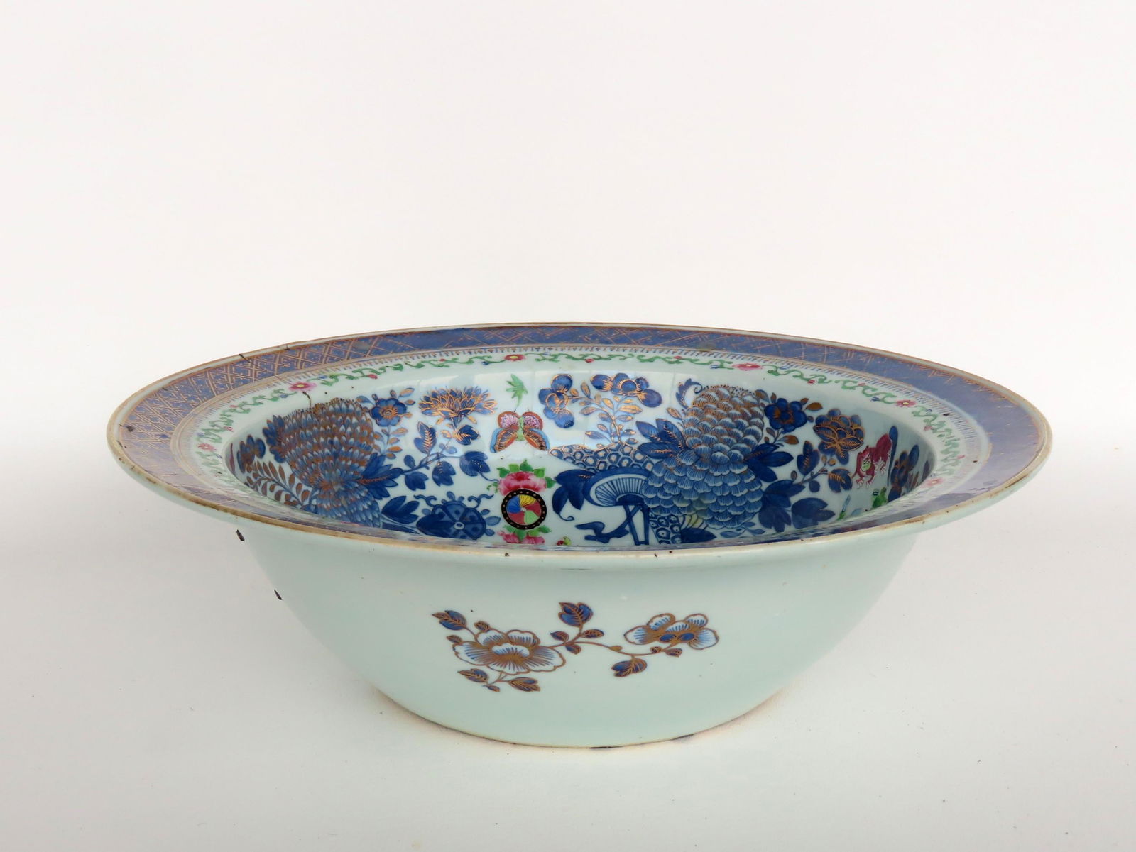 A large Chinese export punch bowl with flared rim and footed base. The interior decorated with (1 of 10)